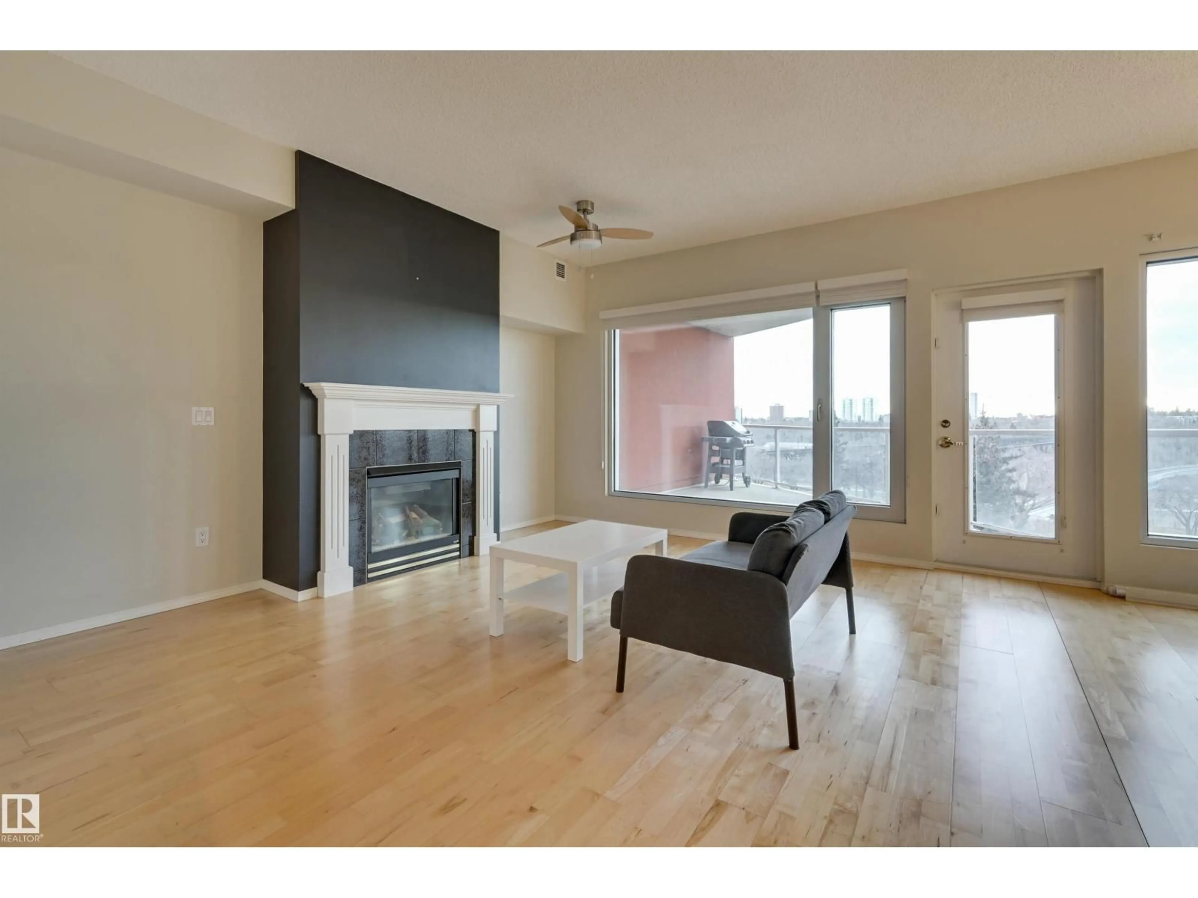 Living room with furniture, wood/laminate floor for 501 - 9708 110 ST, Edmonton Alberta T5K2W3