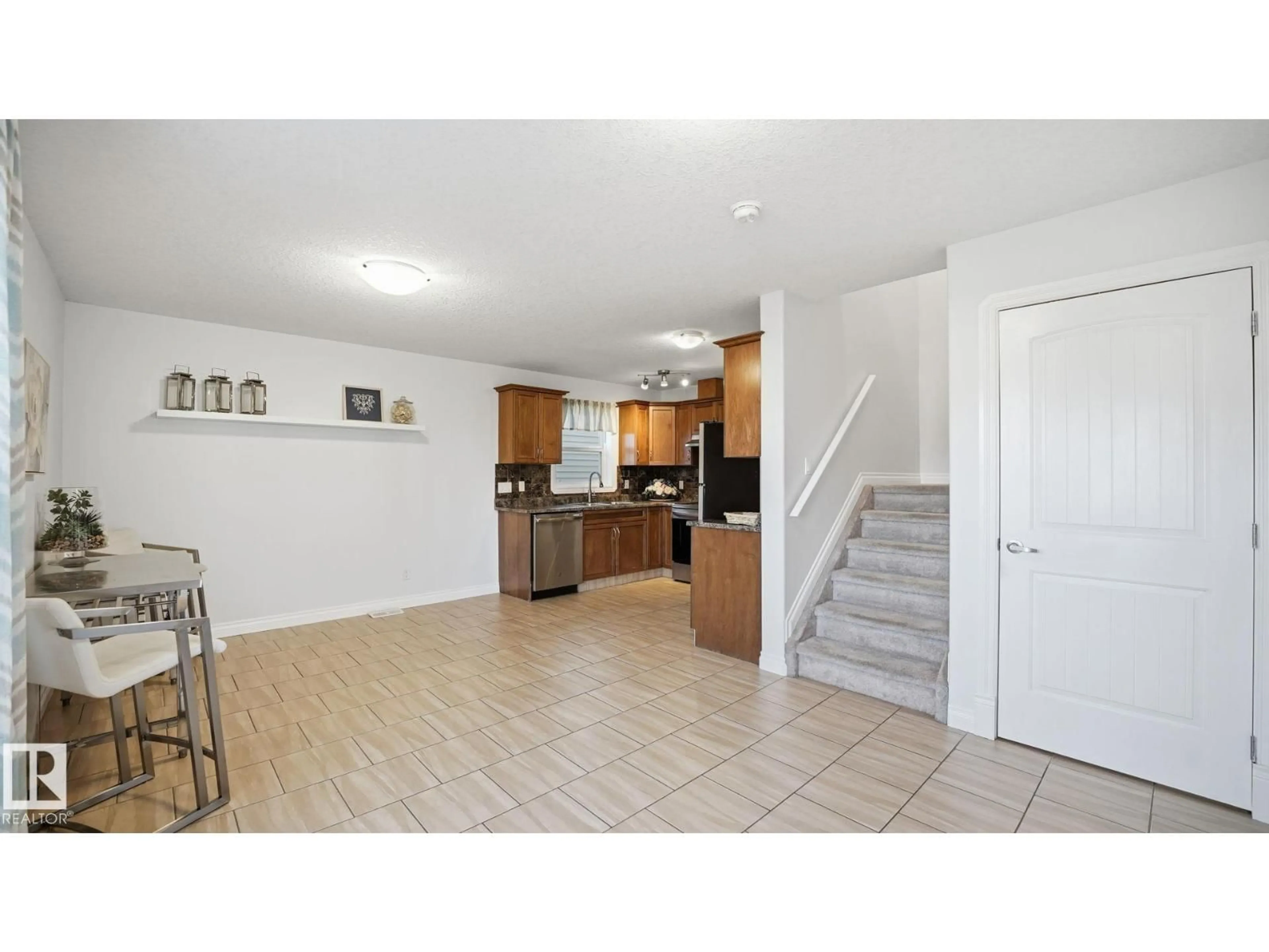 Open concept kitchen, ceramic/tile floor for 14903 109 AV, Edmonton Alberta T5P1M5