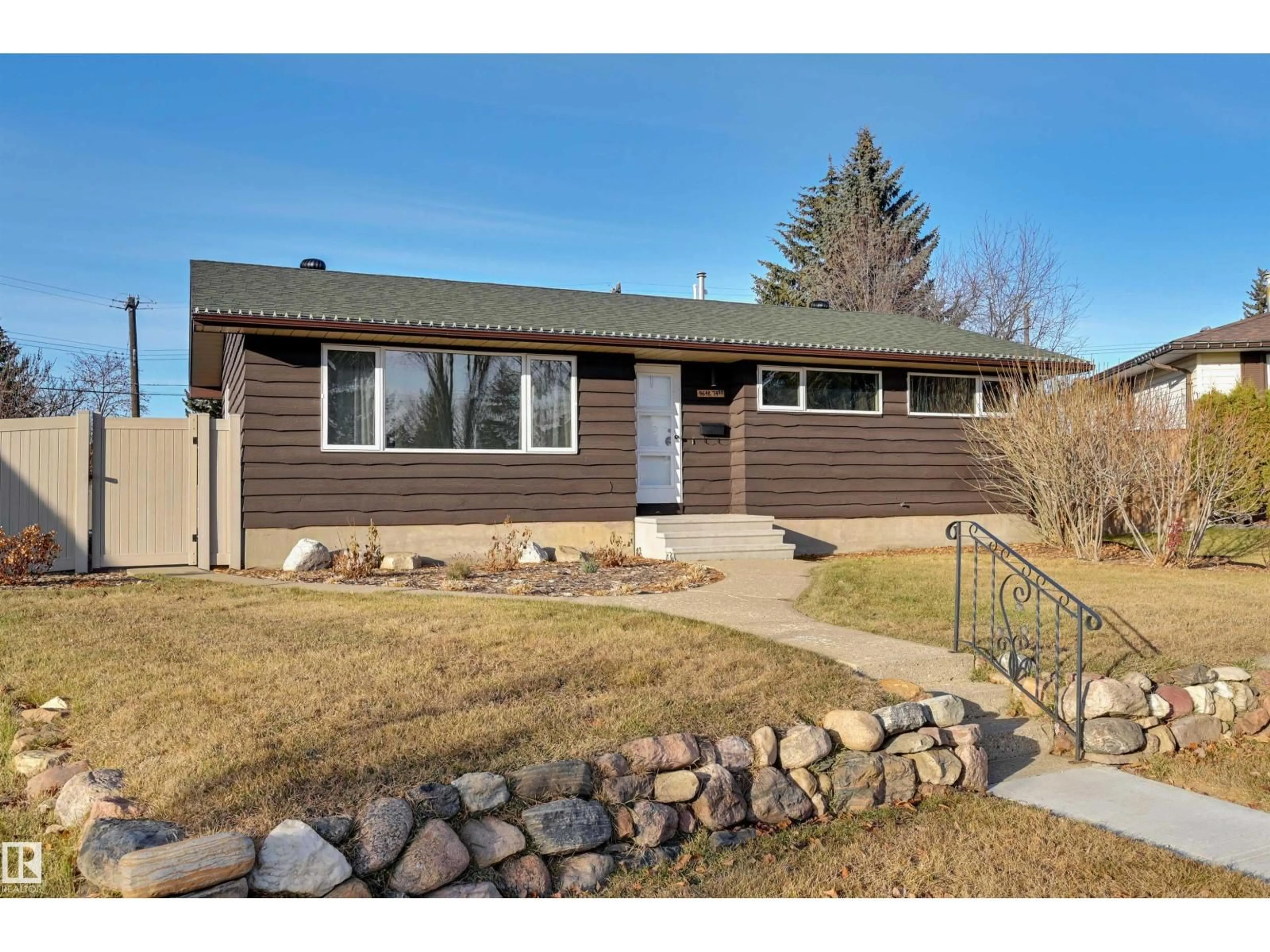 Home with vinyl exterior material, street for 9648 74 ST NW, Edmonton Alberta T6B2B9