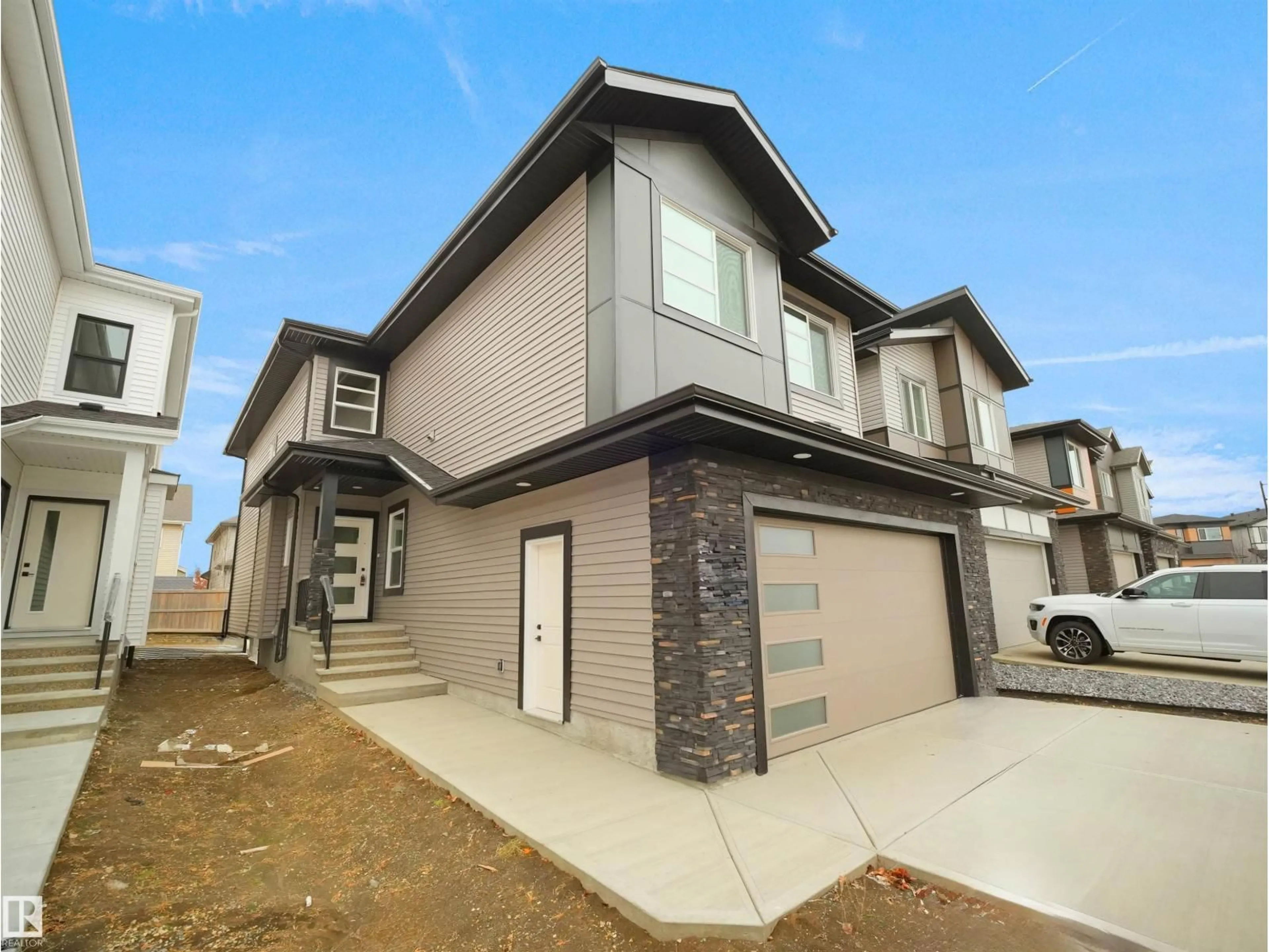 Home with brick exterior material, street for 6811 171 AV, Edmonton Alberta T5Z0W3