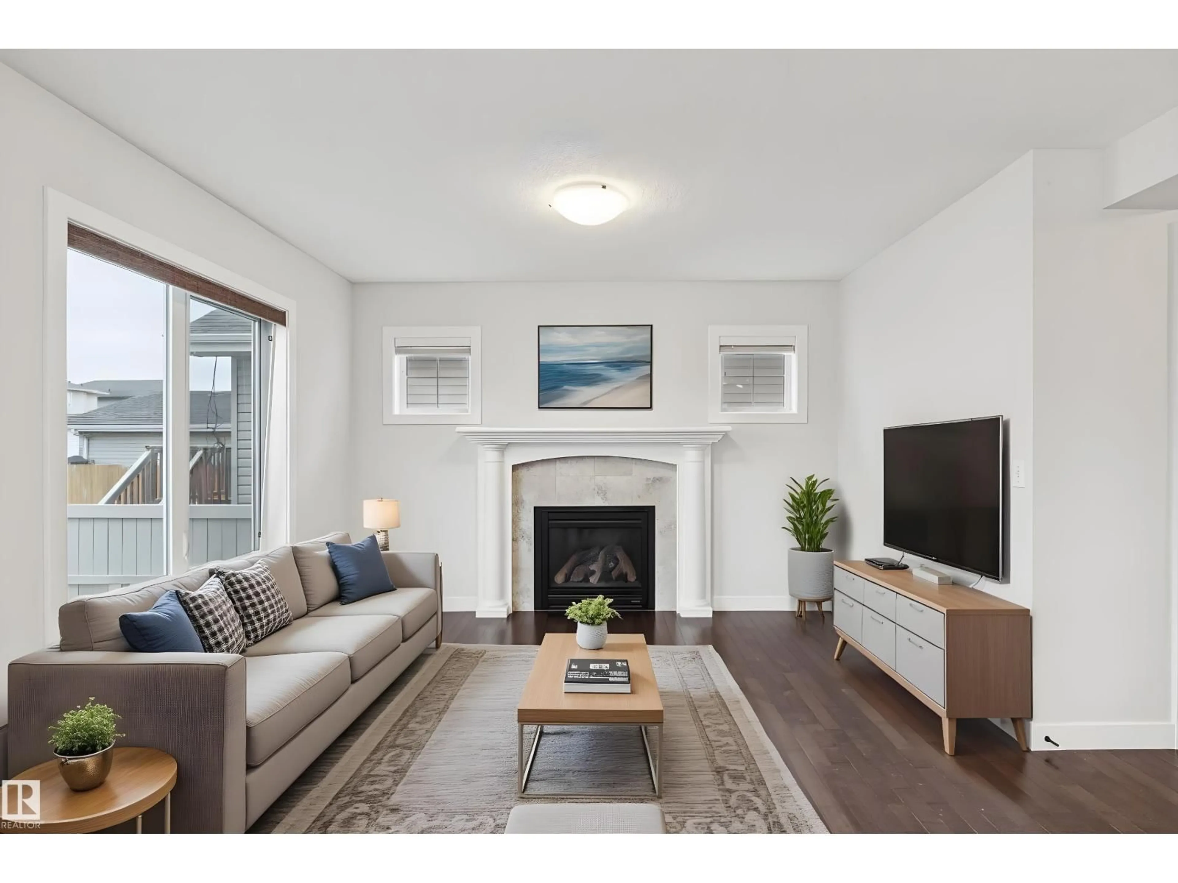 Living room with furniture, wood/laminate floor for 323 AVENA LI, Leduc Alberta T9E0L8