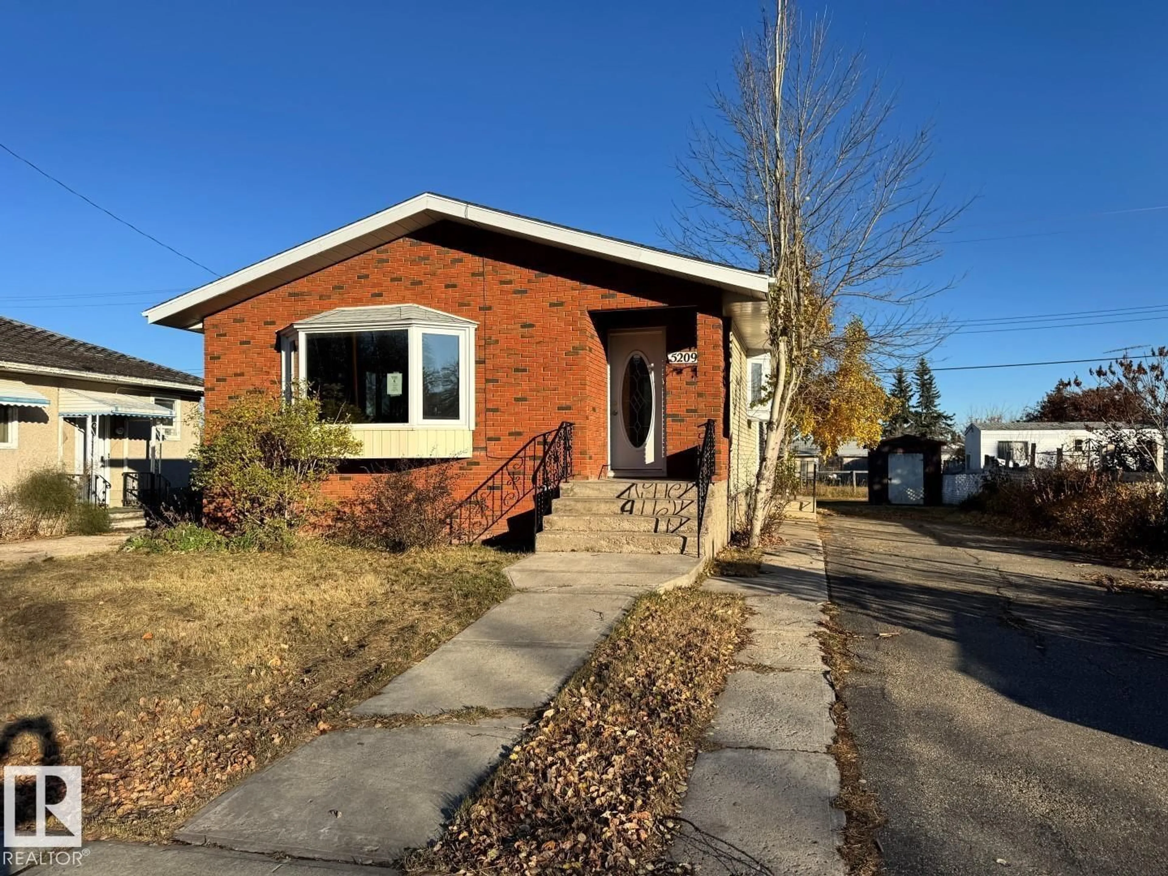 Home with brick exterior material, street for 5209 51 ST, Andrew Alberta T0B0C0