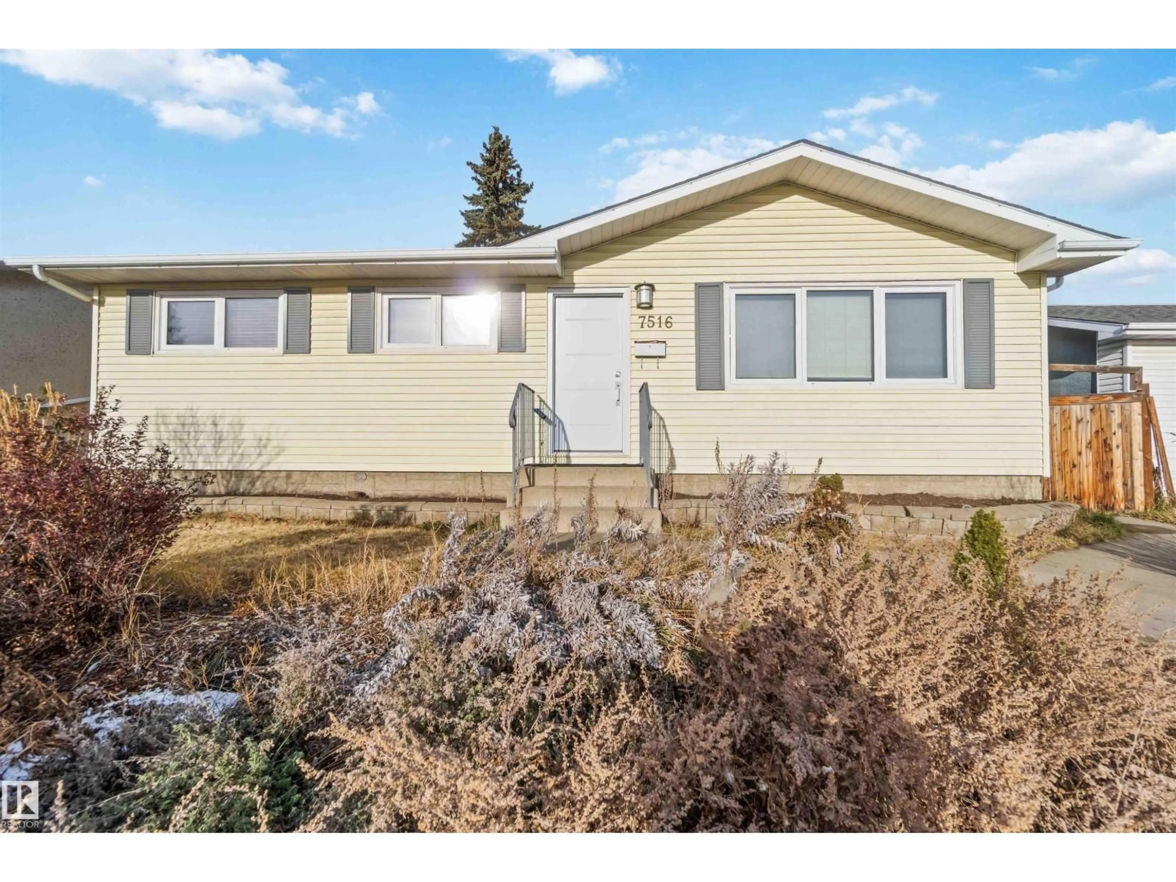 Home with vinyl exterior material, street for 7516 136 AV, Edmonton Alberta T5C2K5