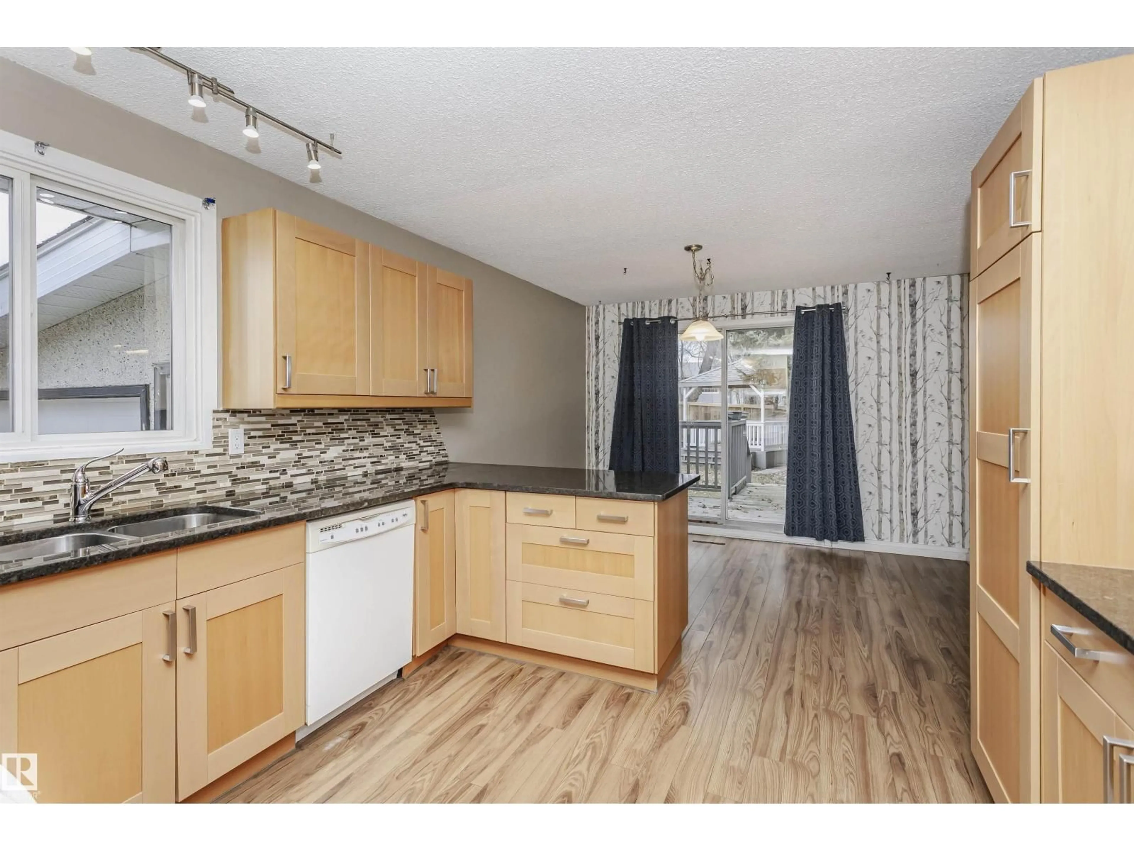Open concept kitchen, wood/laminate floor for 21 CURLEW CR, Sherwood Park Alberta T8A0H3