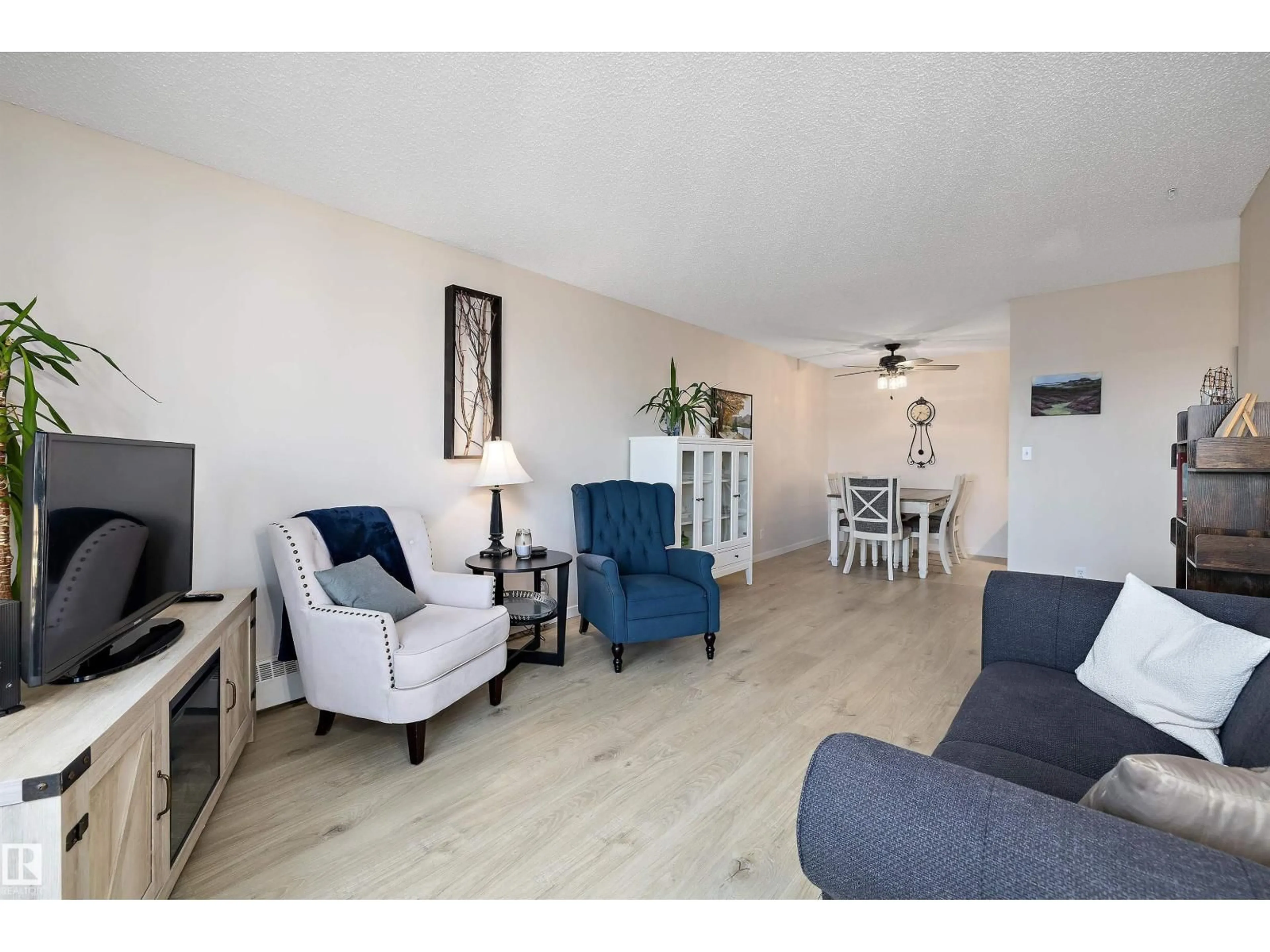 Living room with furniture, unknown for 411 10511 19 AV NW, Edmonton Alberta T6J5S8