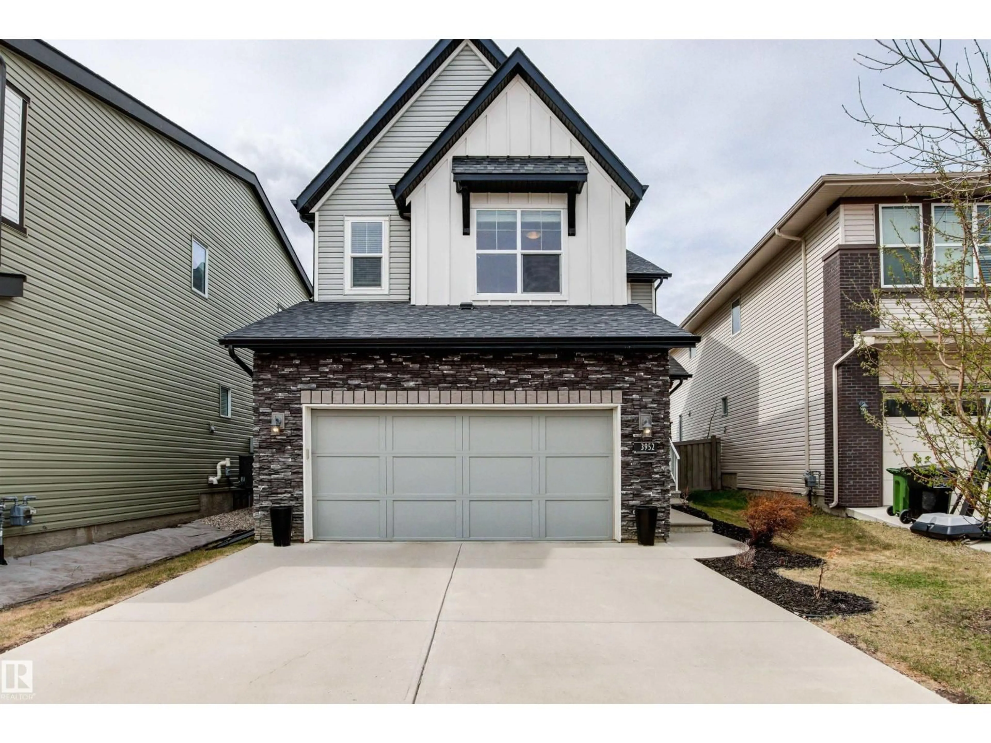 Home with vinyl exterior material, street for SW - 3952 CLAXTON LO, Edmonton Alberta T6W1Y7