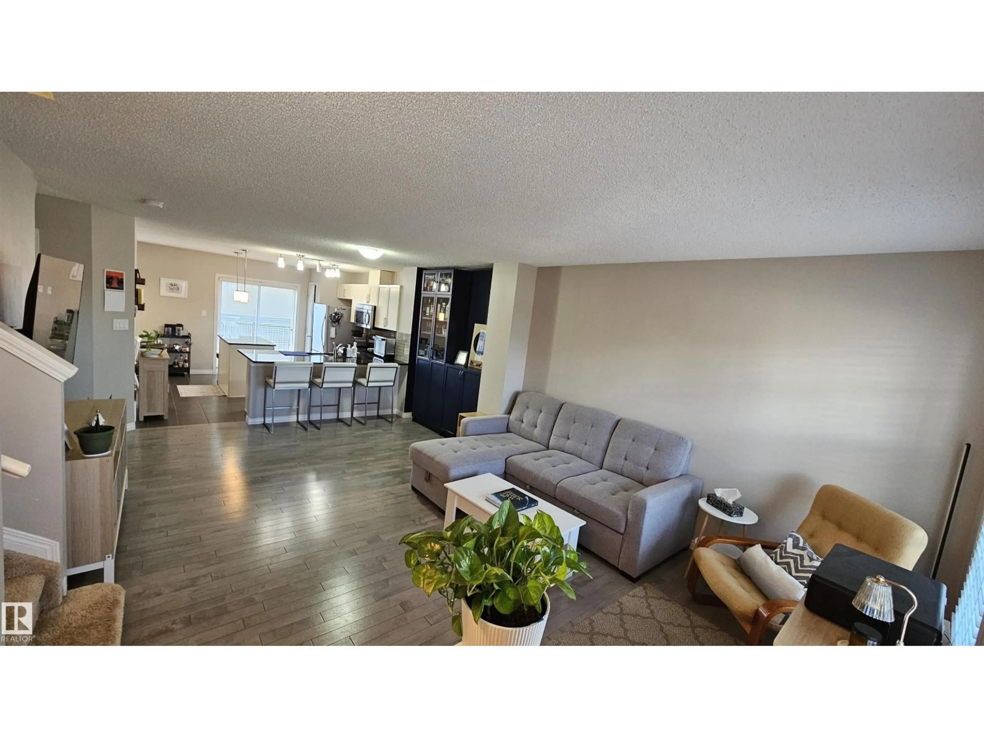 Living room with furniture, wood/laminate floor for 585 ORCHARDS BV, Edmonton Alberta T6X1V2