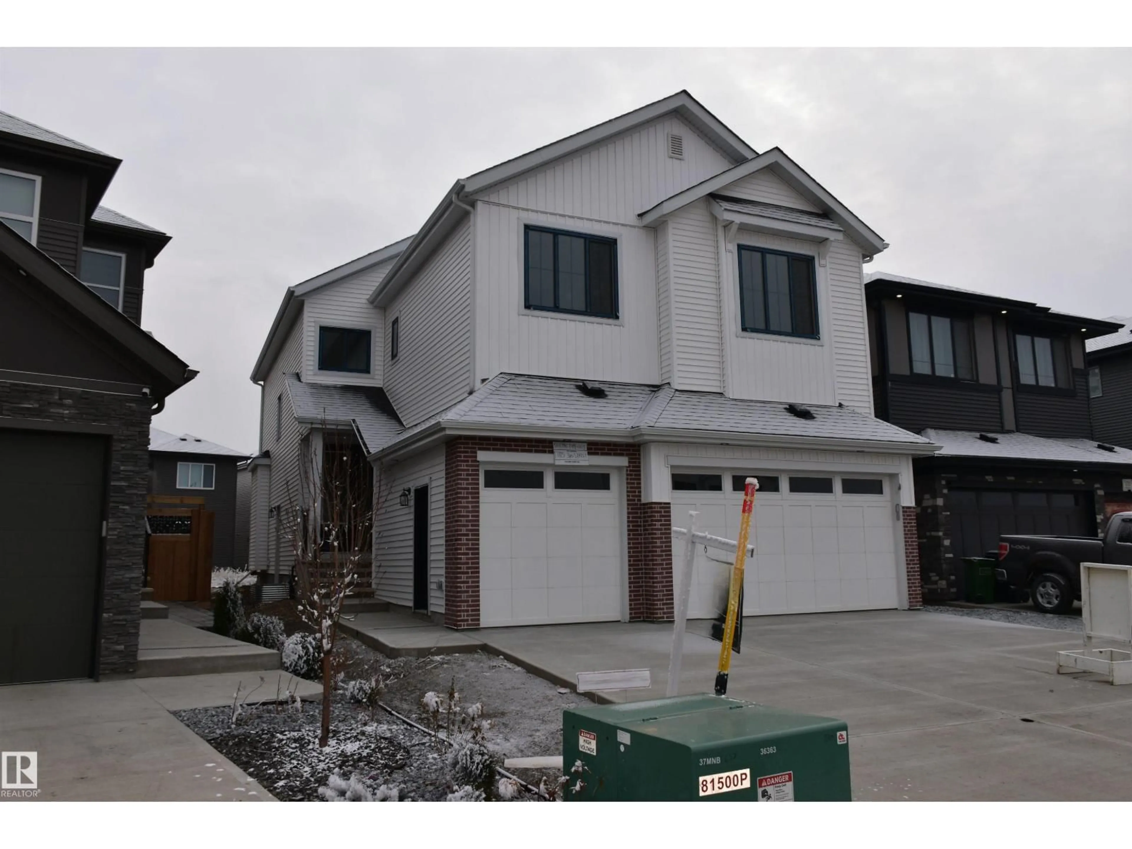 Home with vinyl exterior material, street for 17115 3 ST, Edmonton Alberta T5Y4G8