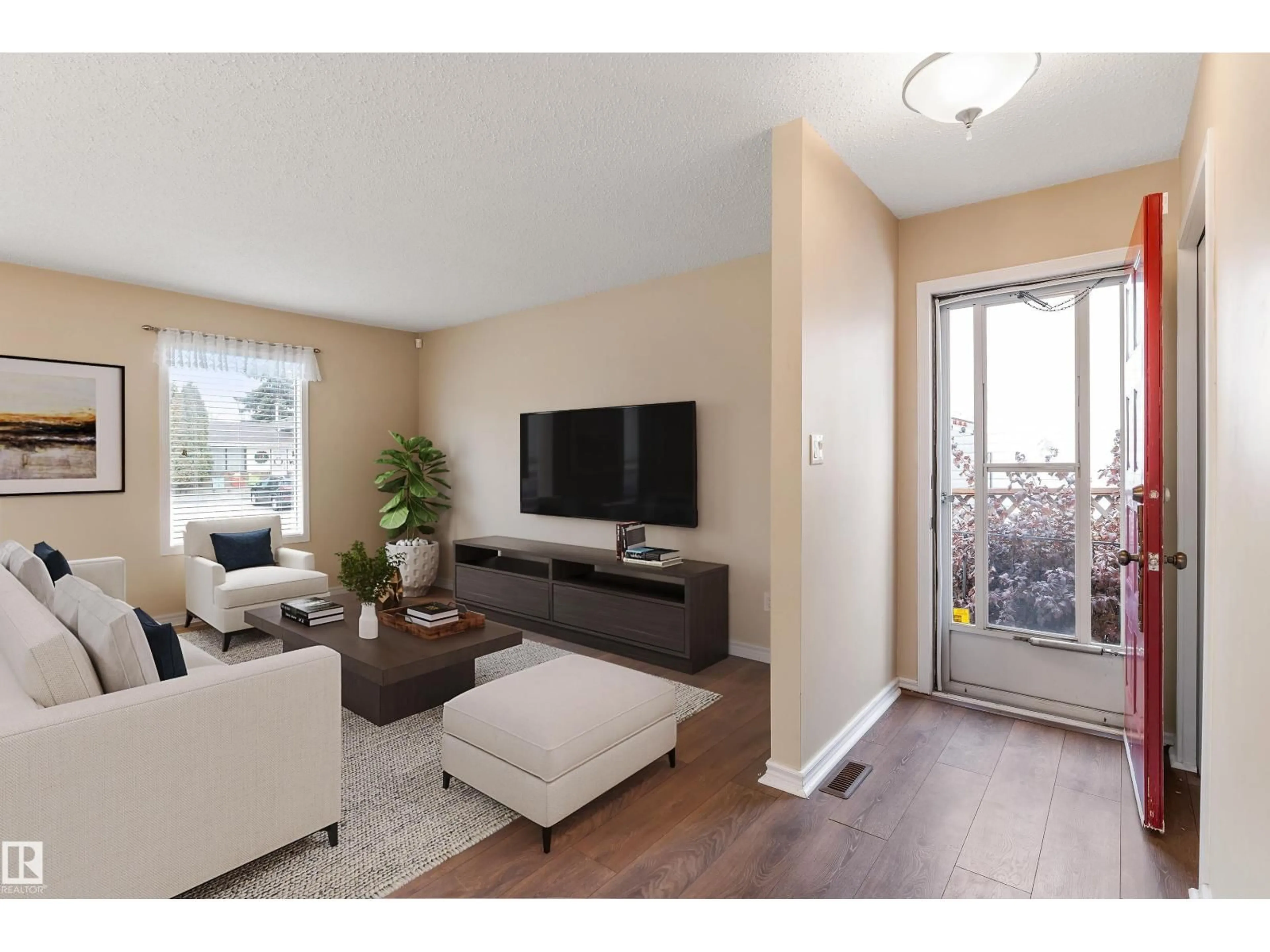 Living room with furniture, wood/laminate floor for 9302 99A, Morinville Alberta T8R1J6