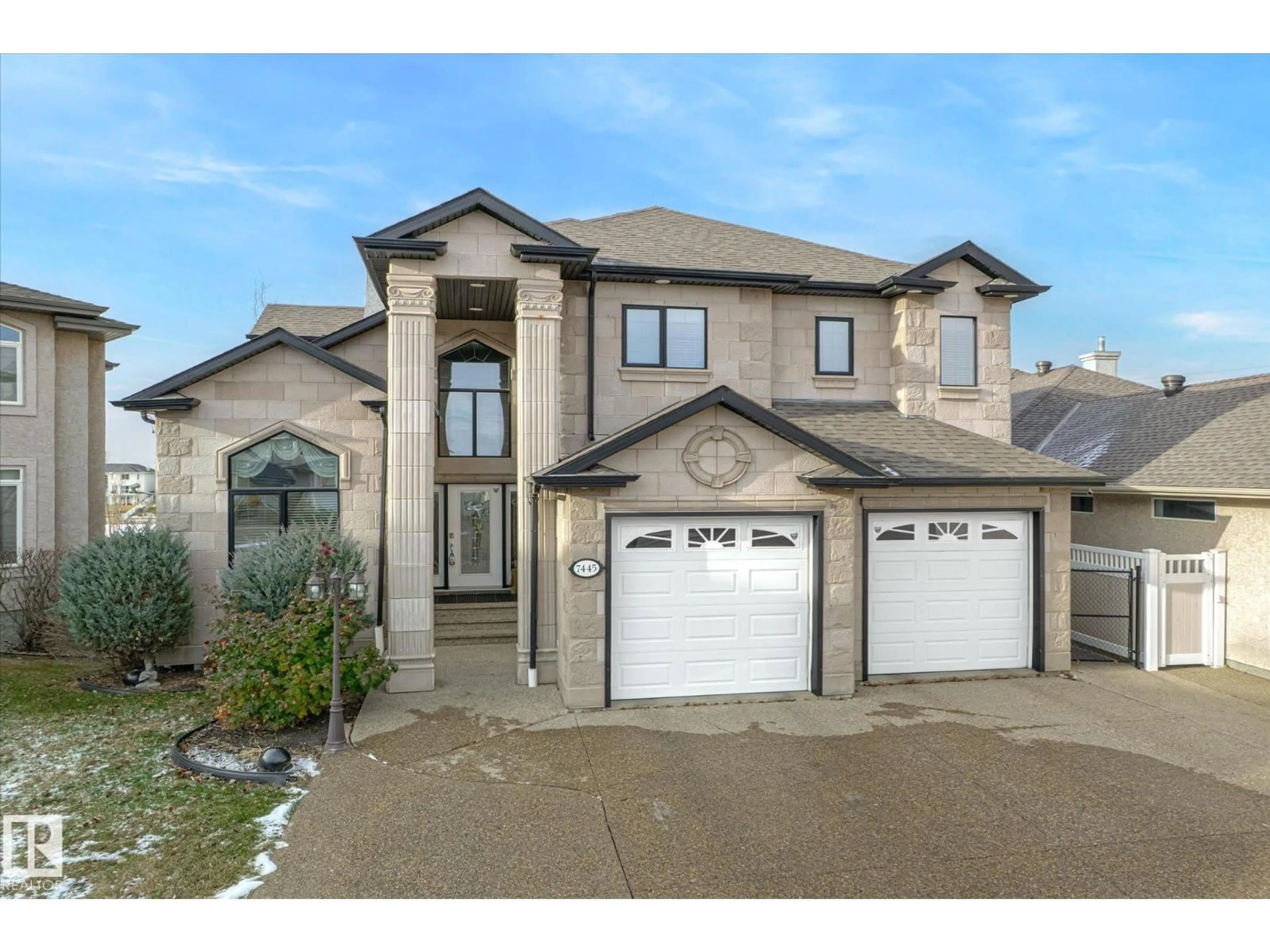 Home with brick exterior material, street for NW - 7445 162 AV, Edmonton Alberta T5Z3S7
