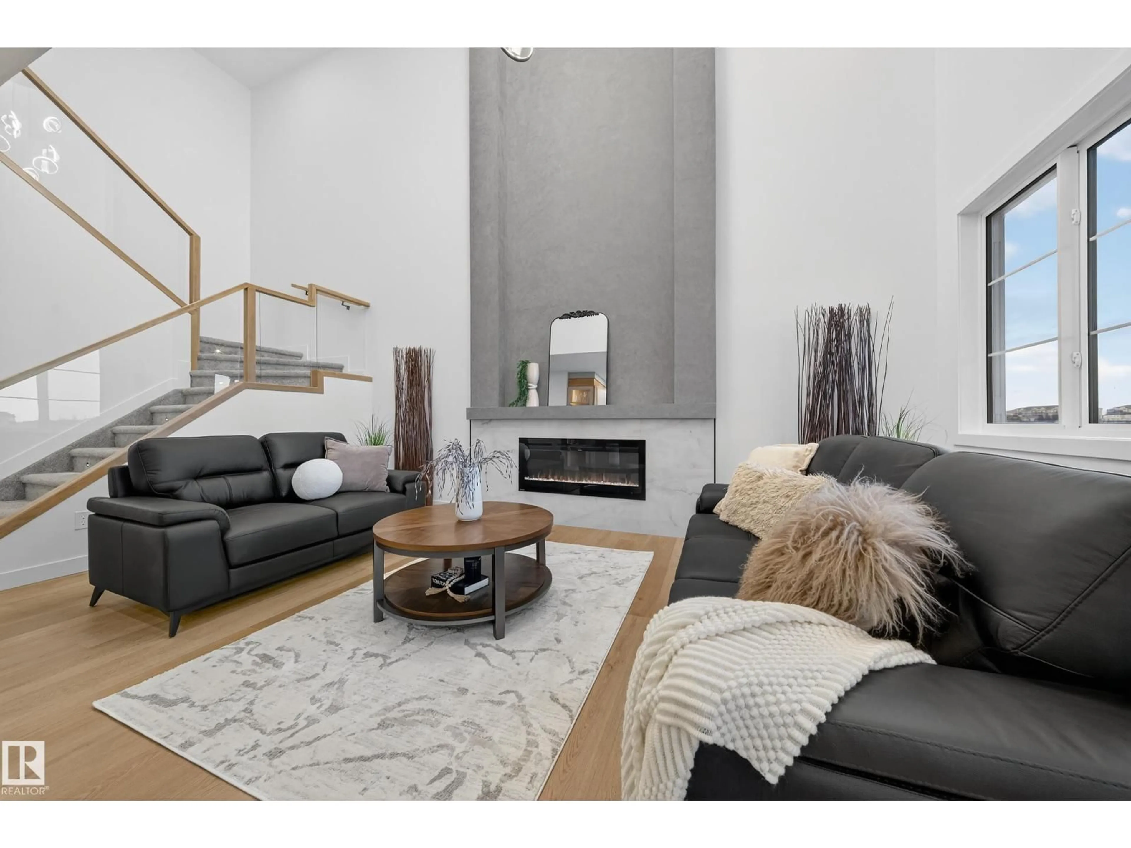 Living room with furniture, wood/laminate floor for 212 CRYSTAL CREEK DRIVE, Leduc Alberta T9E0X6