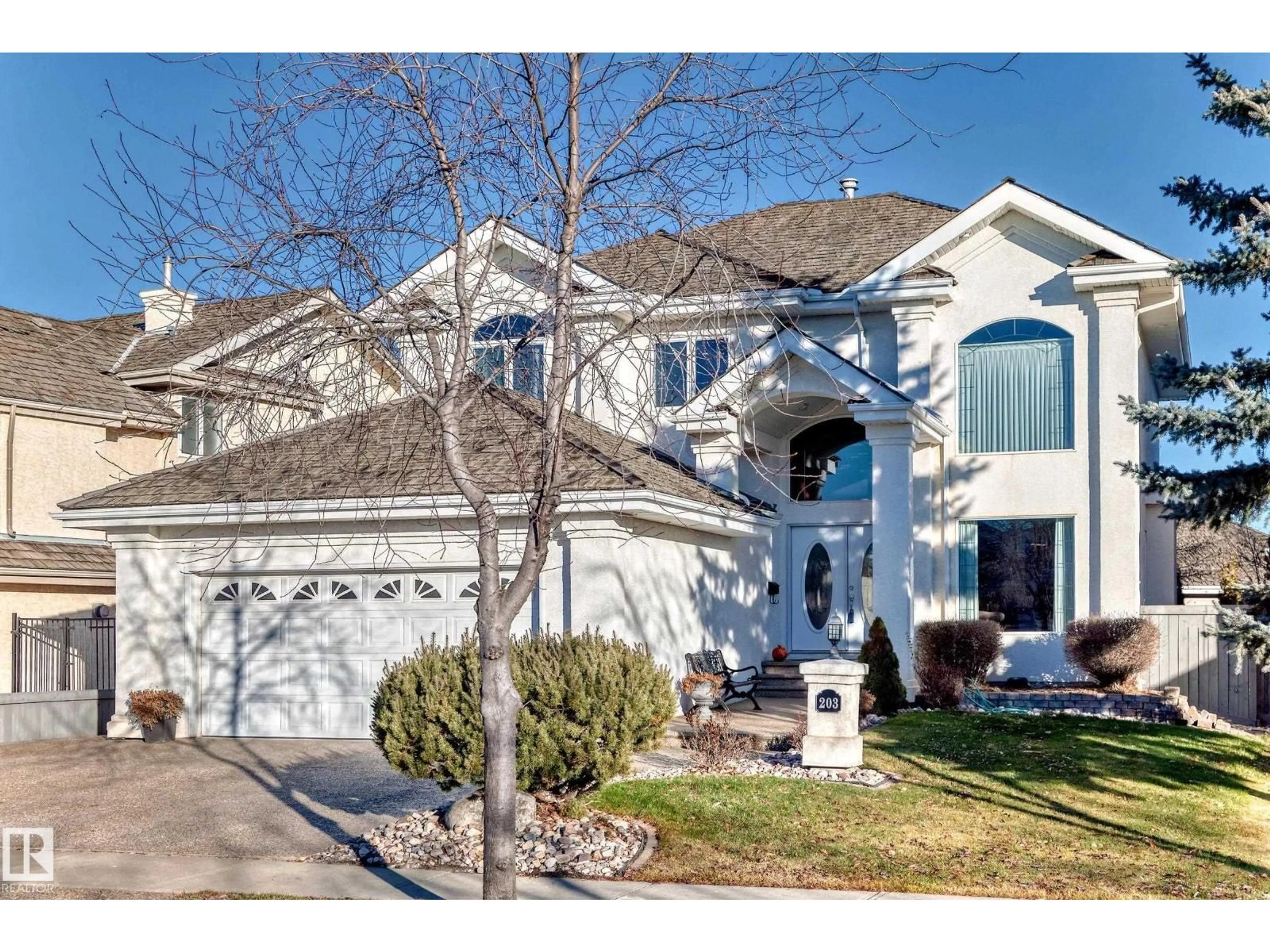Home with vinyl exterior material, street for 203 DARLINGTON CR, Edmonton Alberta T6M2T2