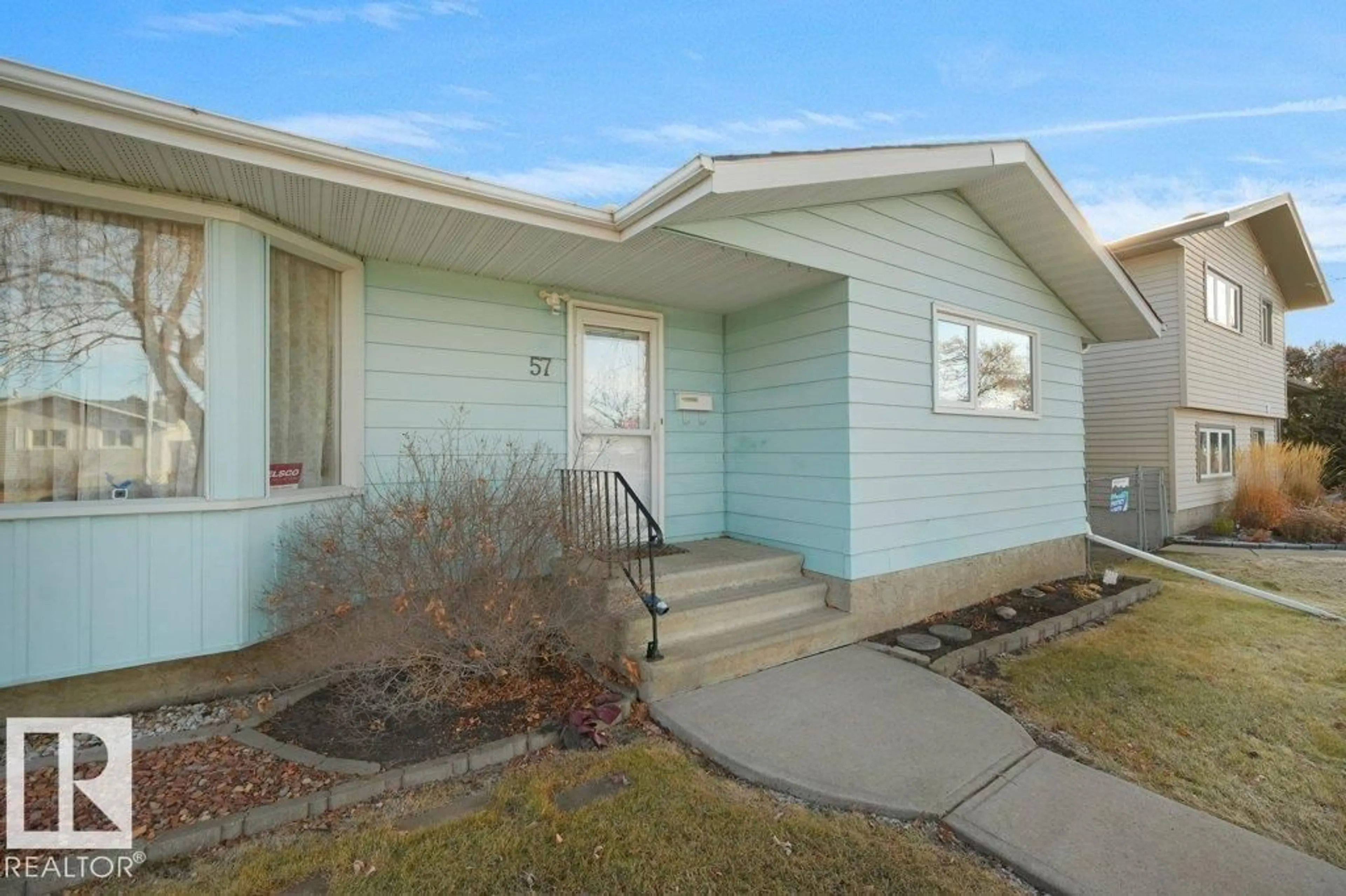 Home with vinyl exterior material, street for 57 HAIDA AV, Leduc Alberta T9E4E7