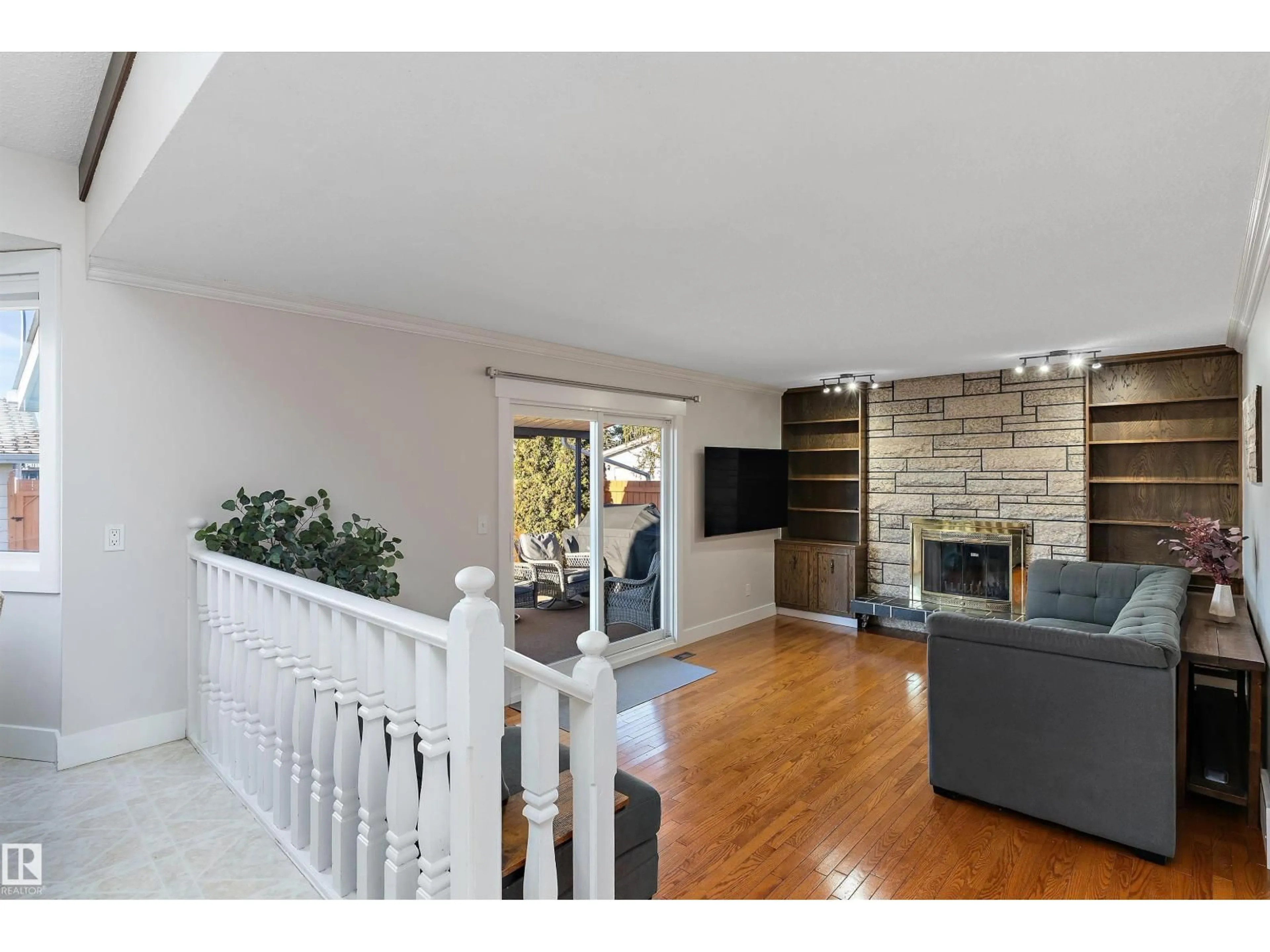 Living room with furniture, wood/laminate floor for NW - 3026 105A ST, Edmonton Alberta T6J3A5