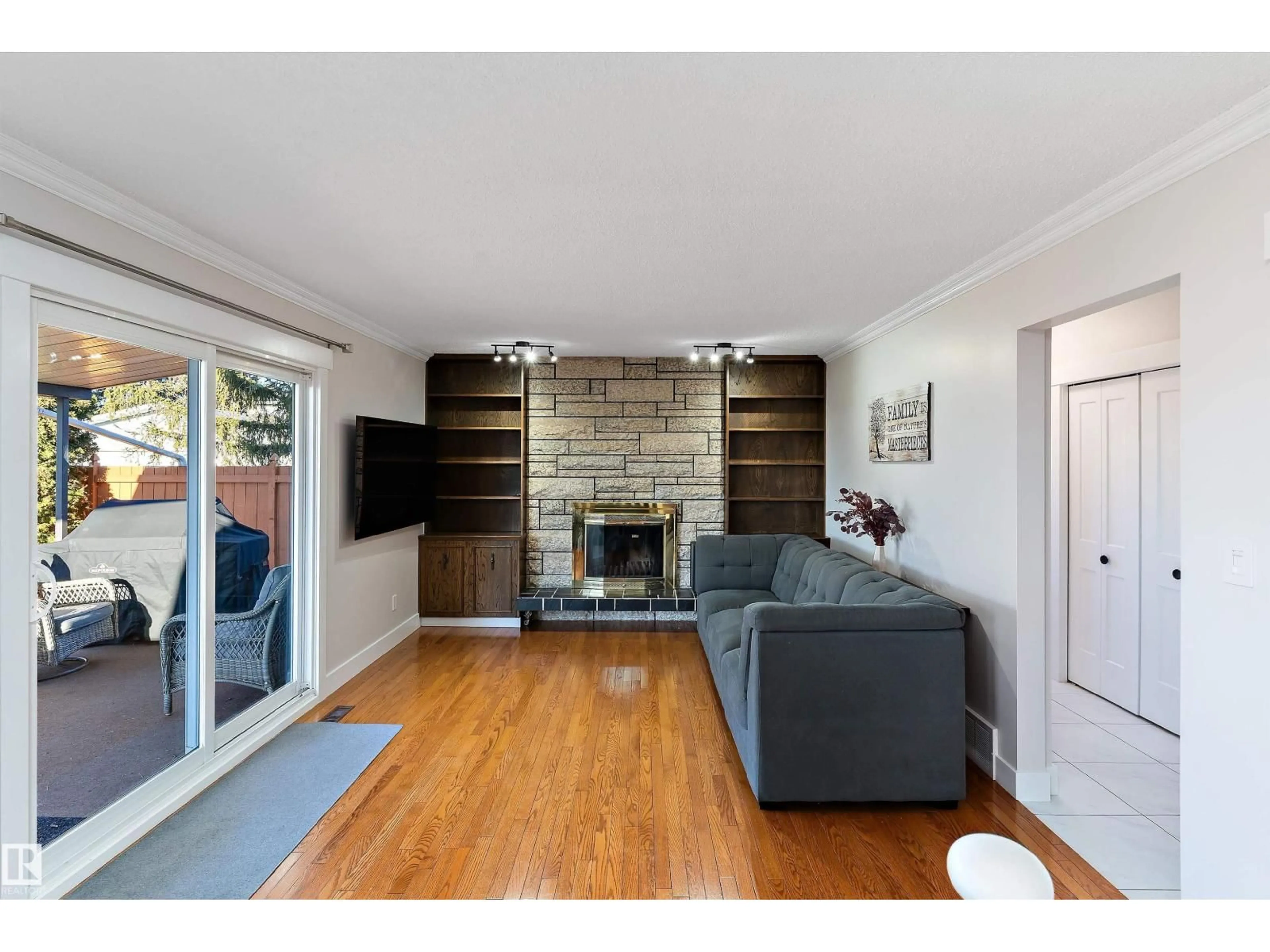 Living room with furniture, wood/laminate floor for NW - 3026 105A ST, Edmonton Alberta T6J3A5