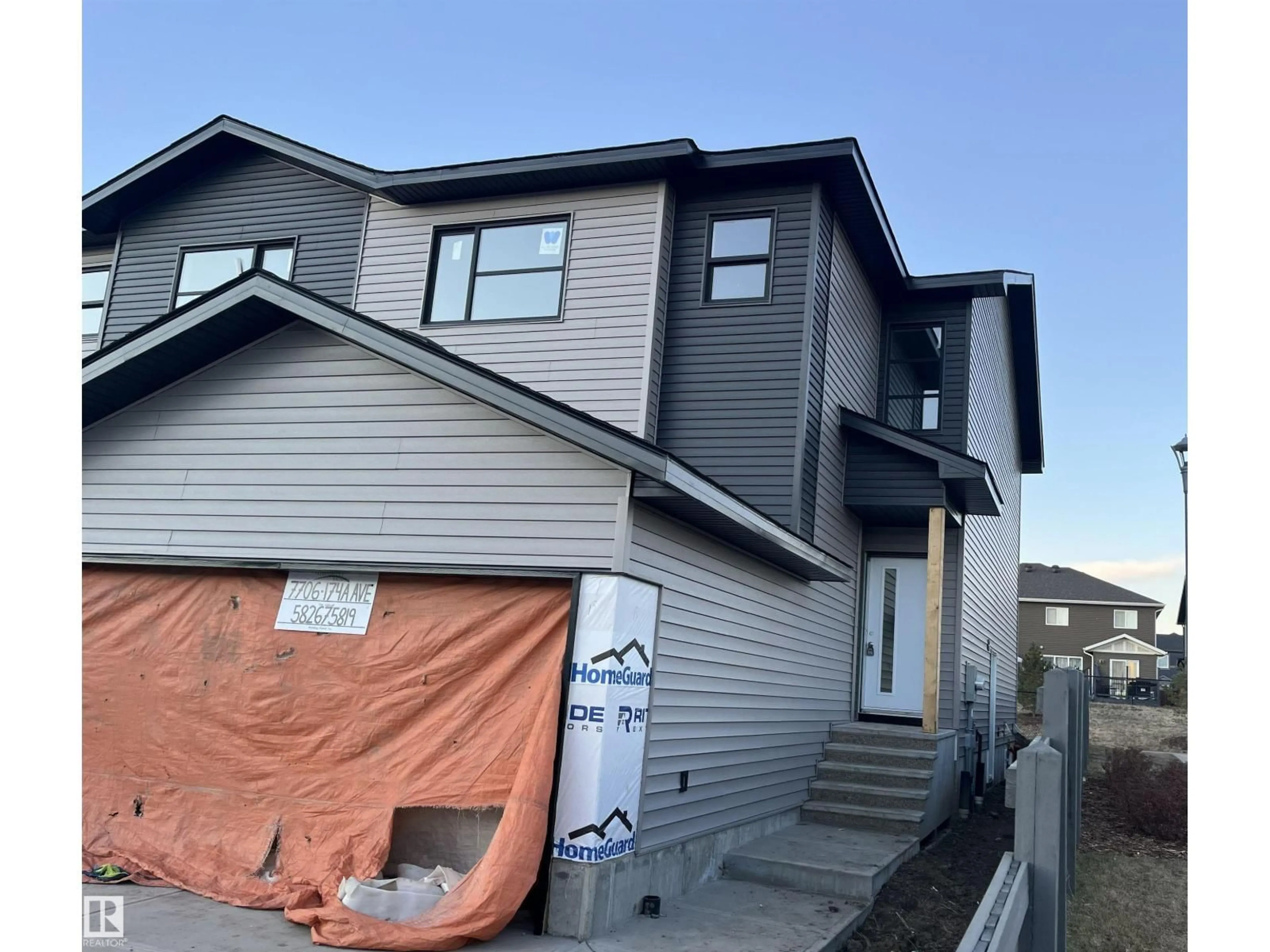 Home with vinyl exterior material, street for 7706 174A AV, Edmonton Alberta T5Z0W5