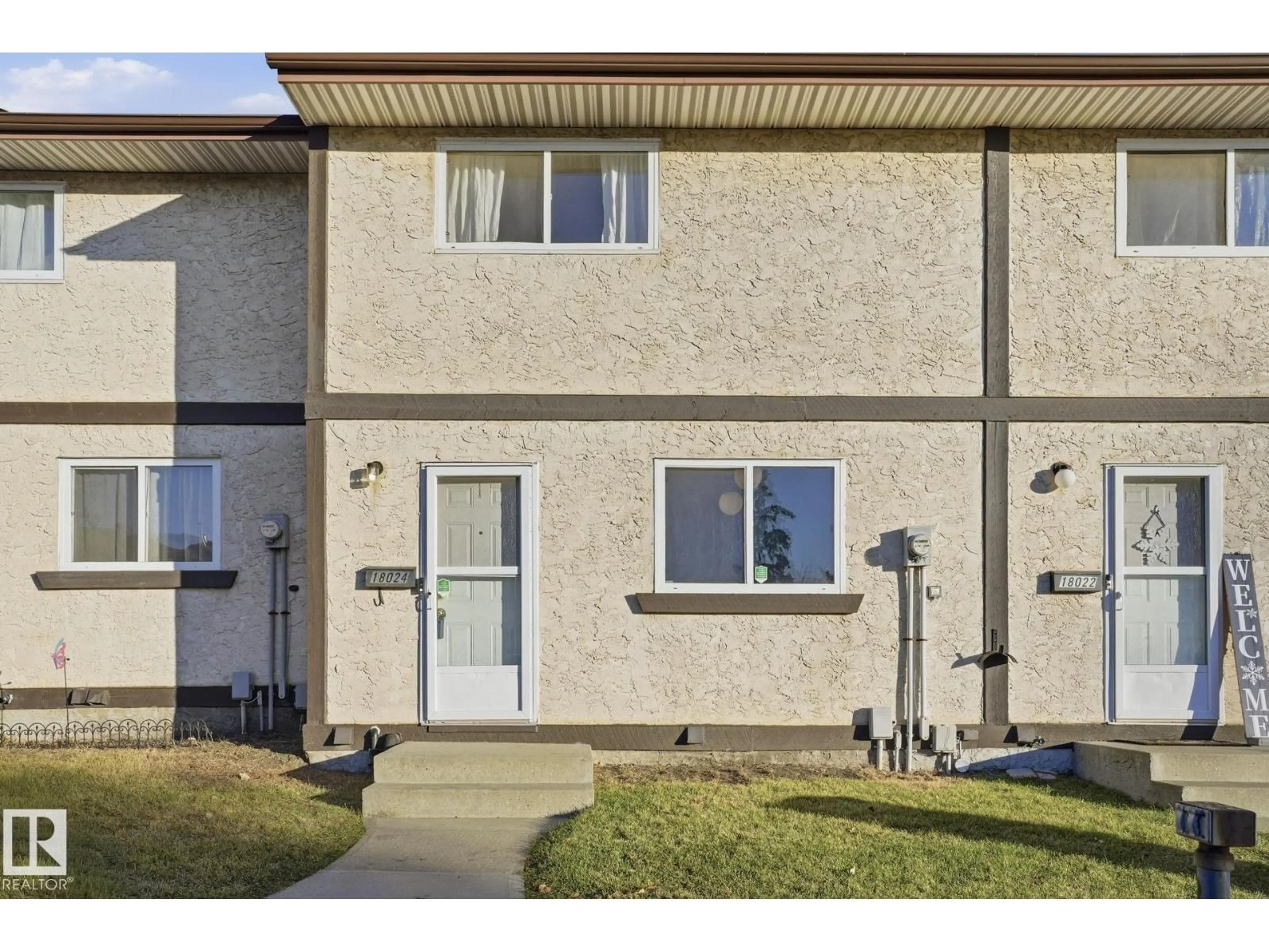 Home with vinyl exterior material, street for 18024 93 AV, Edmonton Alberta T6E5P5