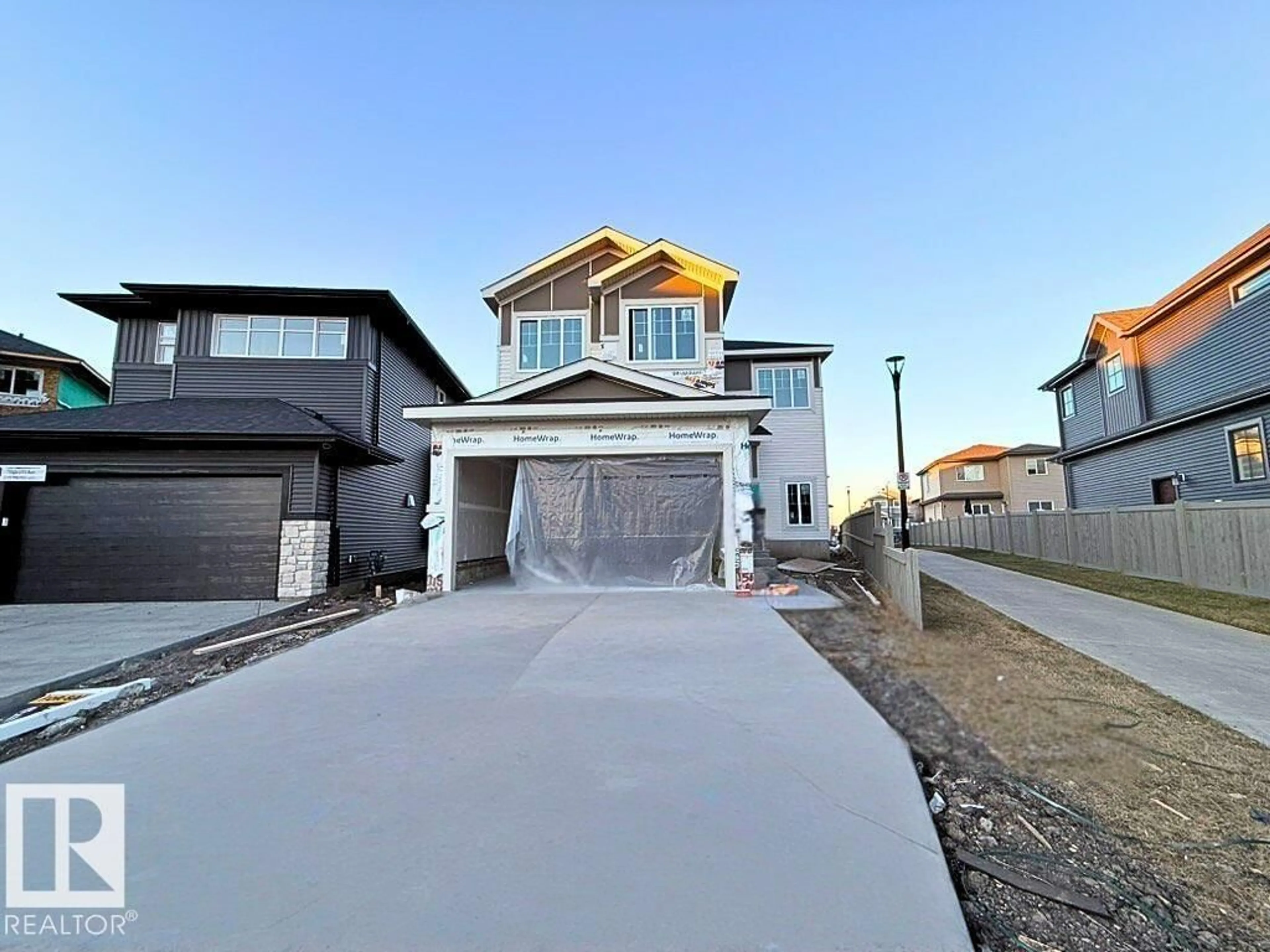 Home with vinyl exterior material, street for NW - 7156 177 AV, Edmonton Alberta T5Z0W9