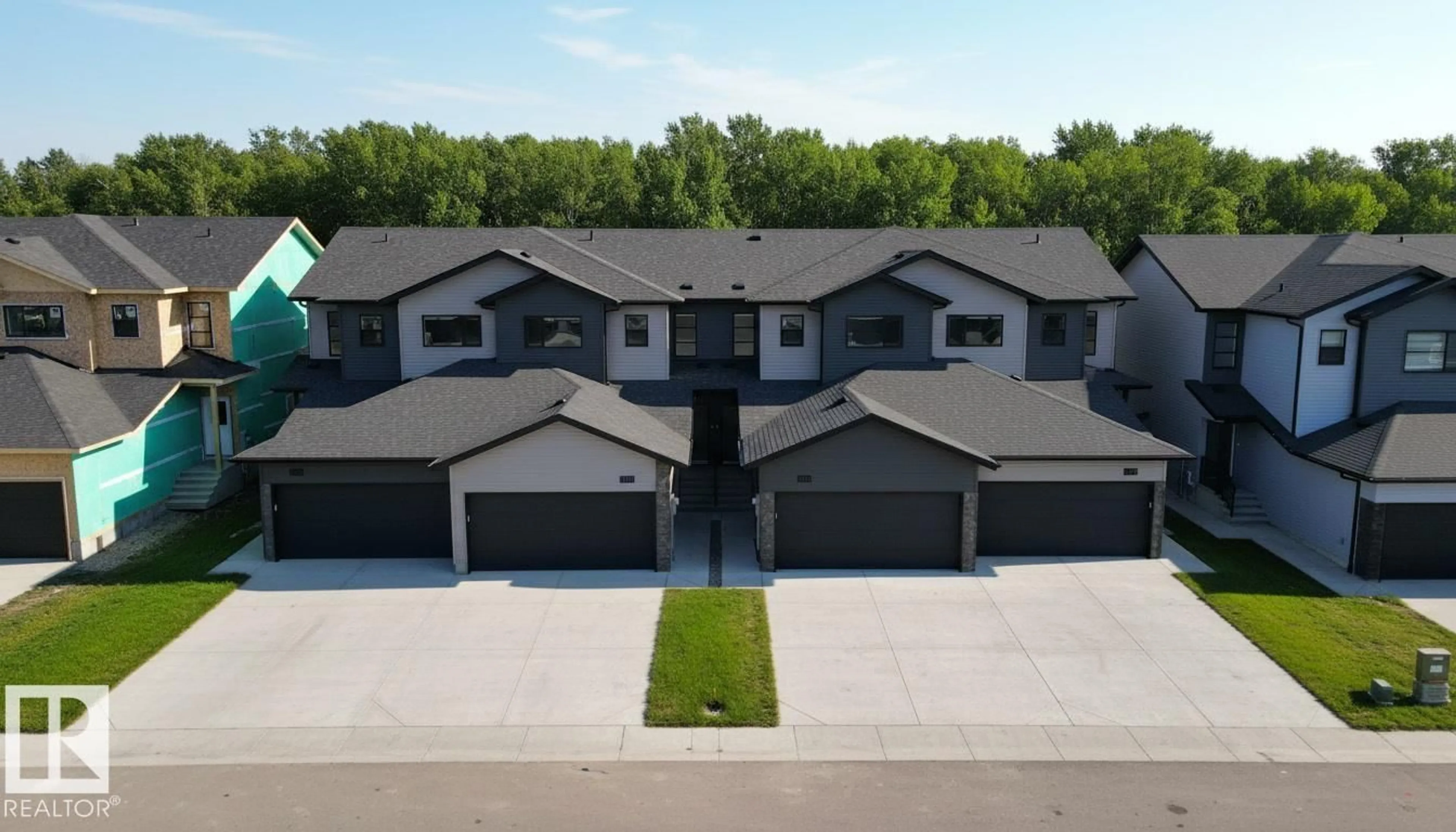 A pic from outside/outdoor area/front of a property/back of a property/a pic from drone, street for 7585 174A AV, Edmonton Alberta T5Z0W5