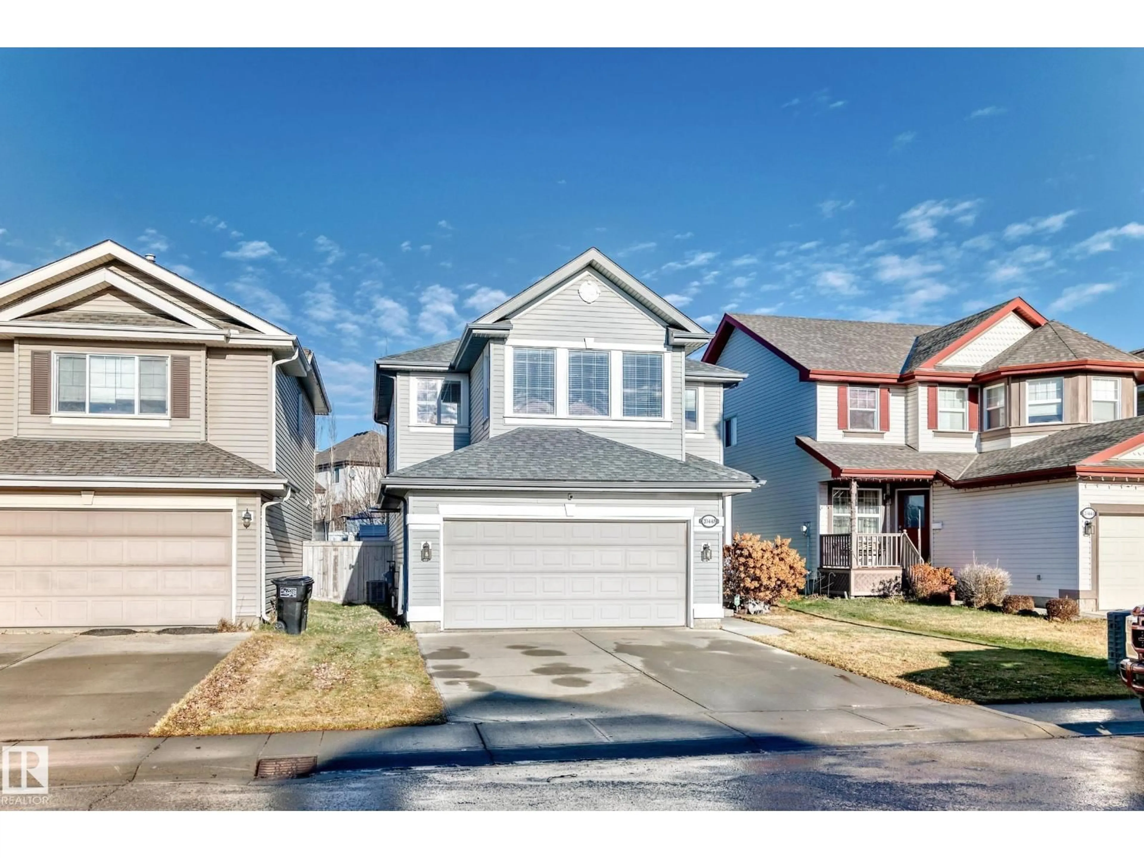 Home with vinyl exterior material, street for 20448 56 AV, Edmonton Alberta T6M0B8