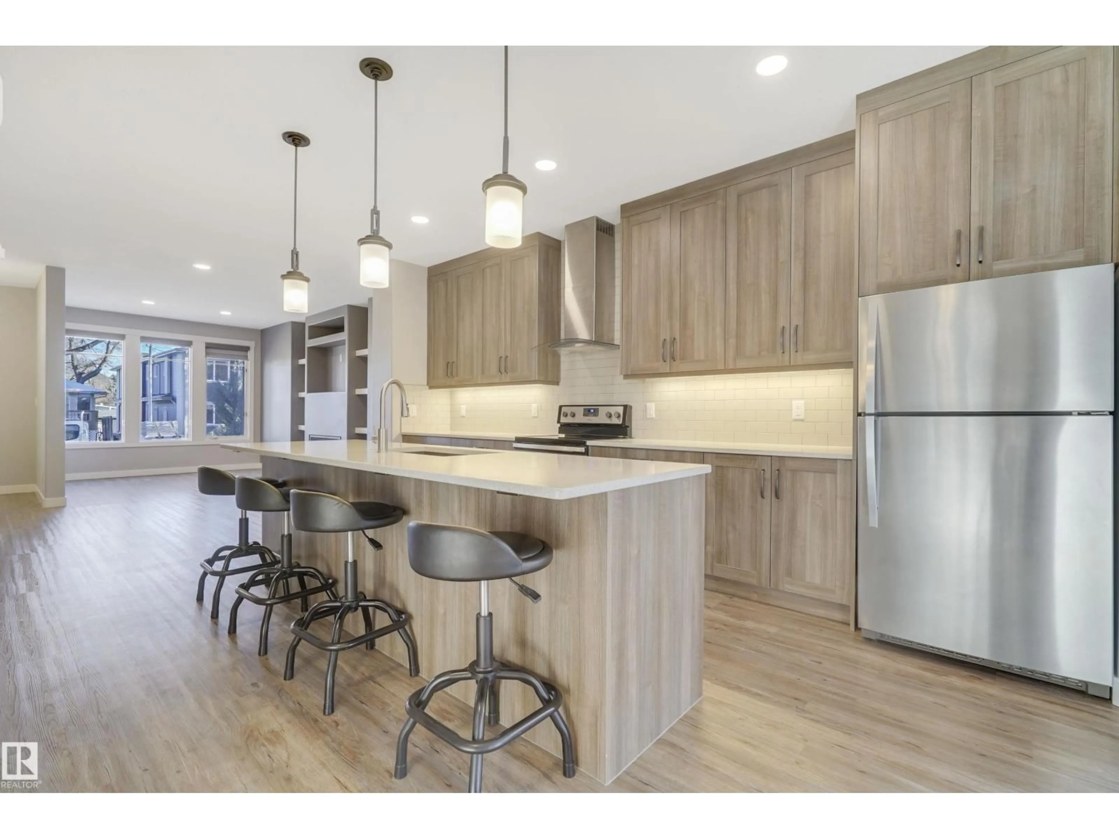 Open concept kitchen, wood/laminate floor for 8540 89 ST, Edmonton Alberta T6C3K3