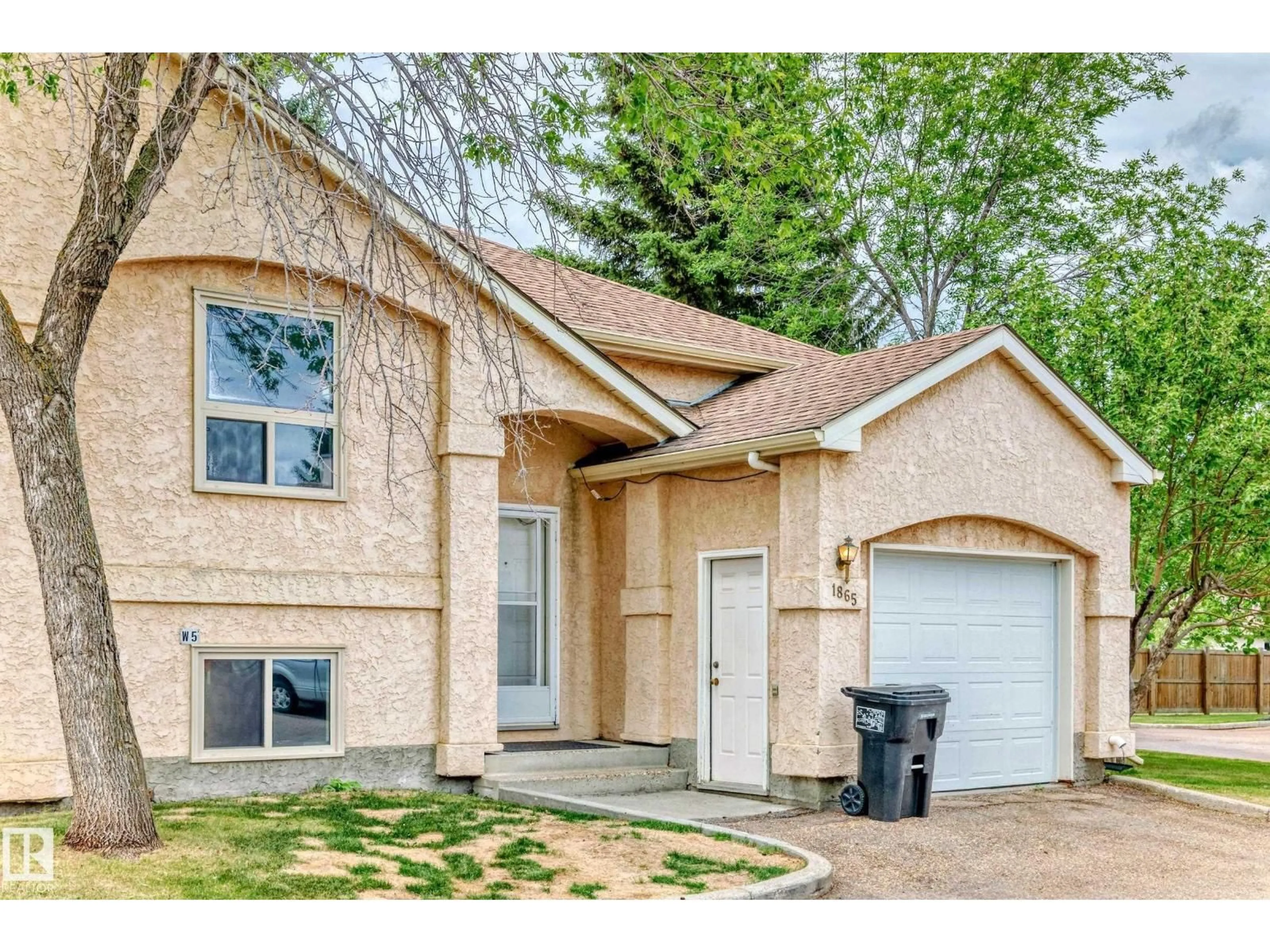 Home with brick exterior material, street for 1865 MILL WOODS RD E, Edmonton Alberta T6L6K2