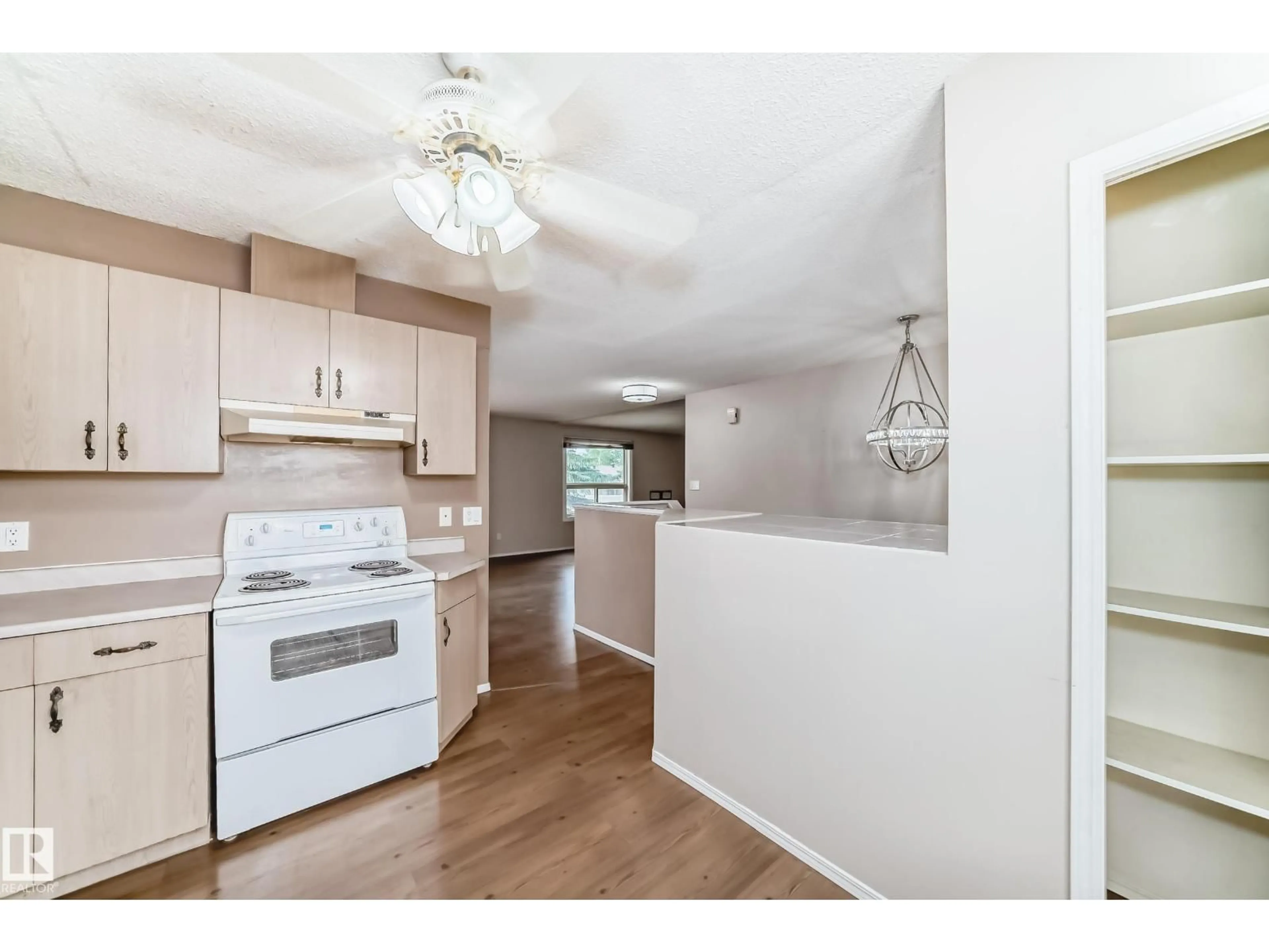 Open concept kitchen, wood/laminate floor for 1865 MILL WOODS RD E, Edmonton Alberta T6L6K2