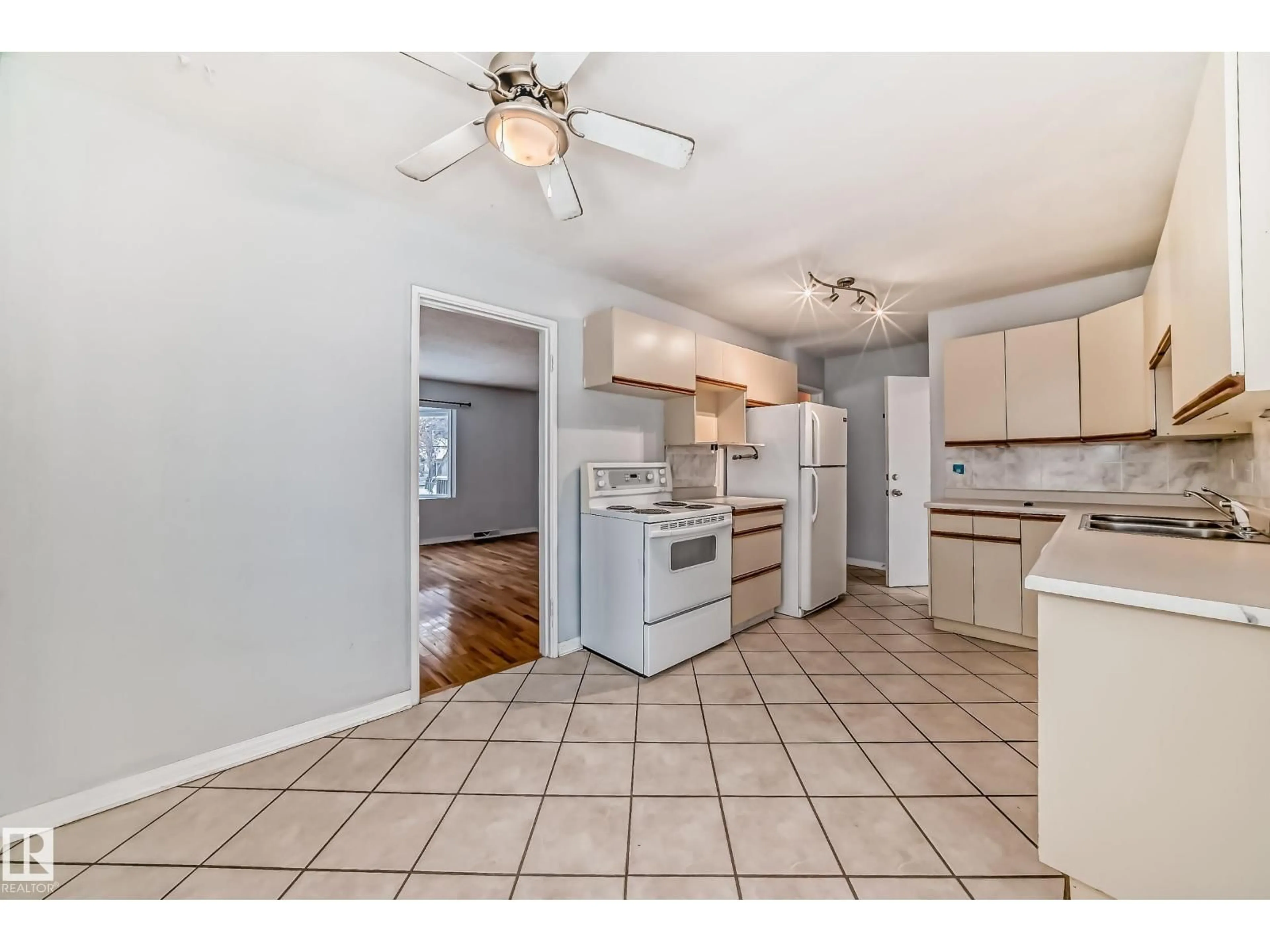 Open concept kitchen, ceramic/tile floor for 7539 76 AV, Edmonton Alberta T6C0H3