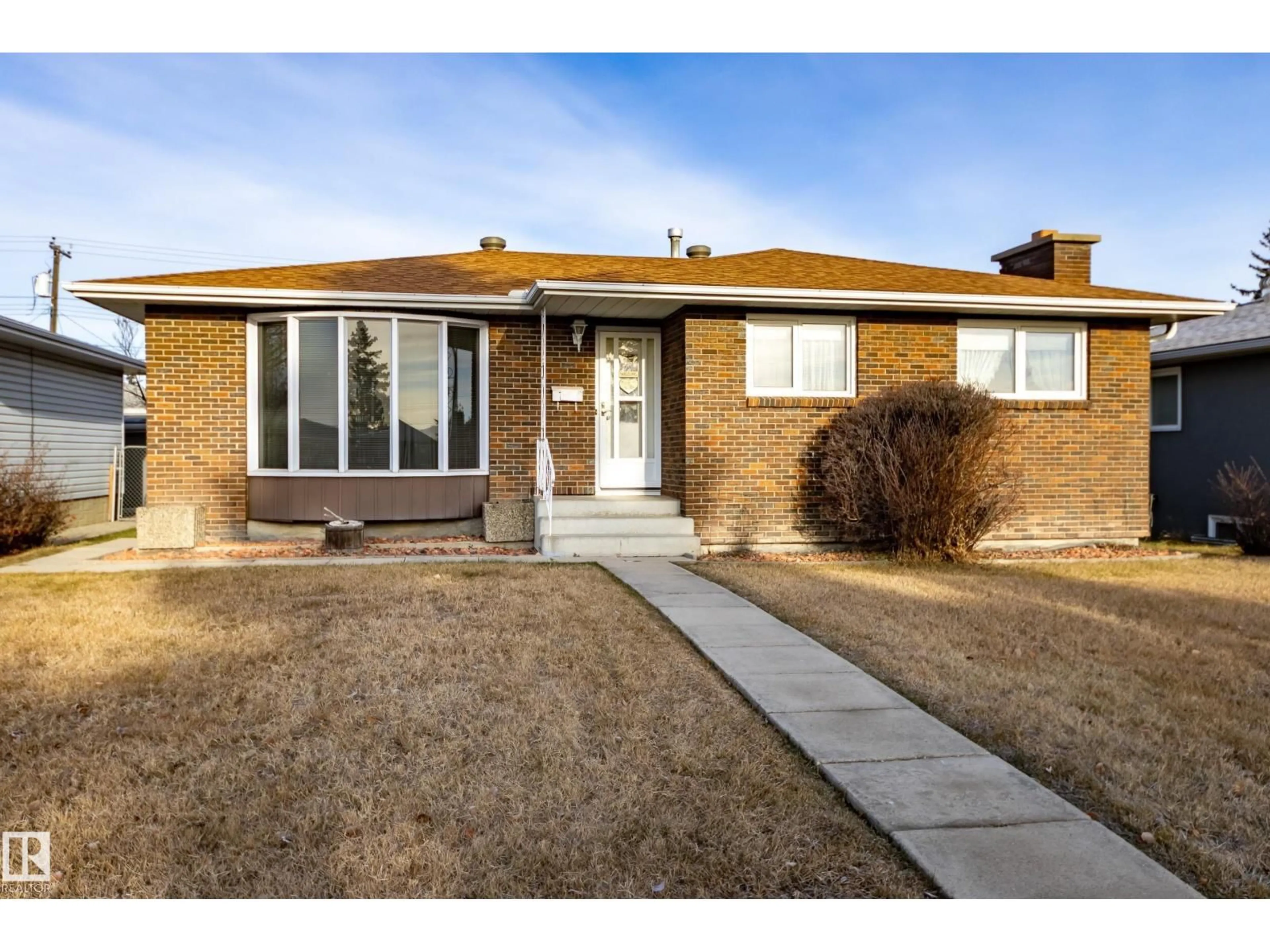 Home with brick exterior material, street for NW - 7620 136 AV, Edmonton Alberta T5C2K5