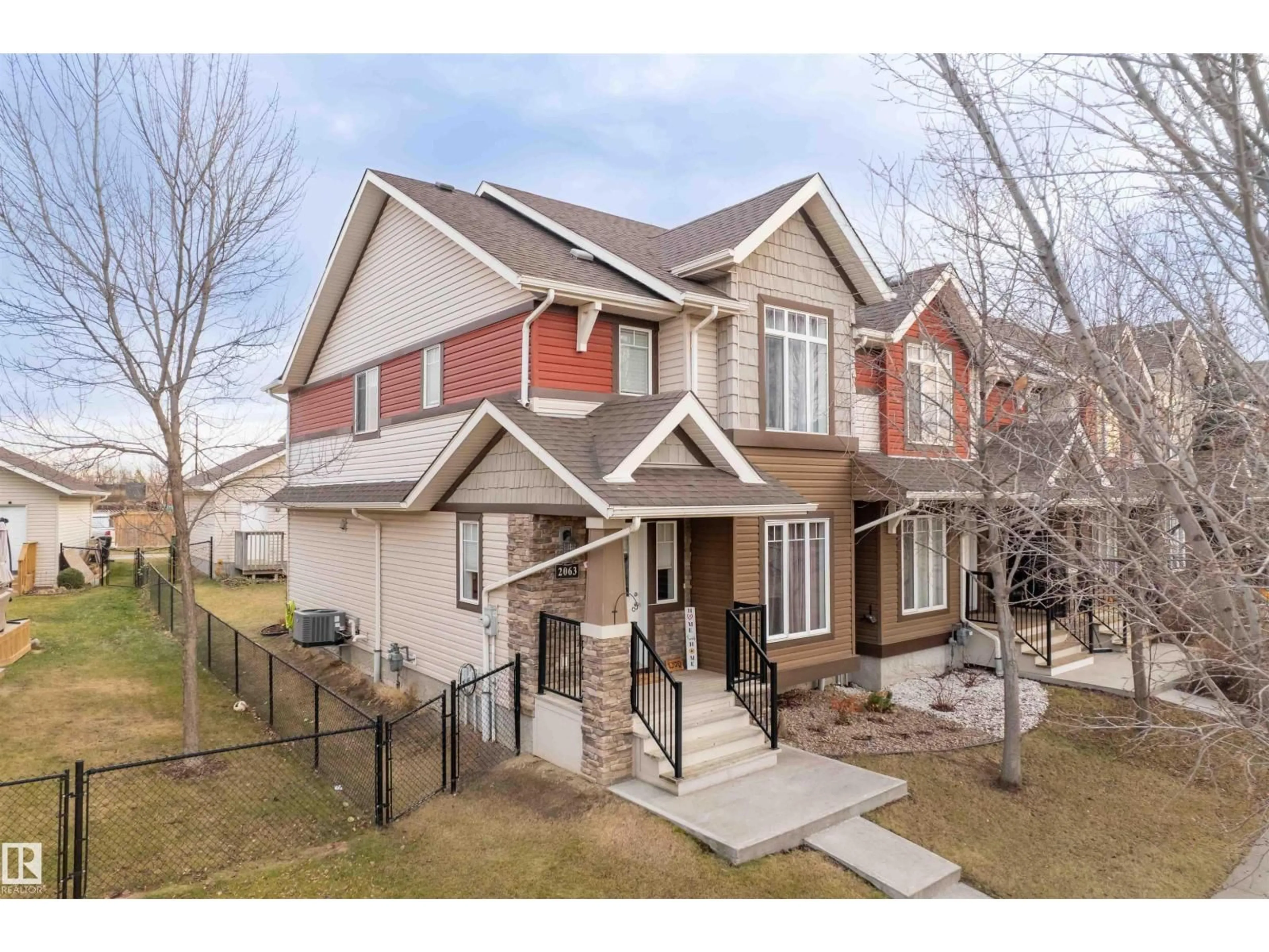 Home with brick exterior material, street for 2063 TRUMPETER WY, Edmonton Alberta T5S0E7