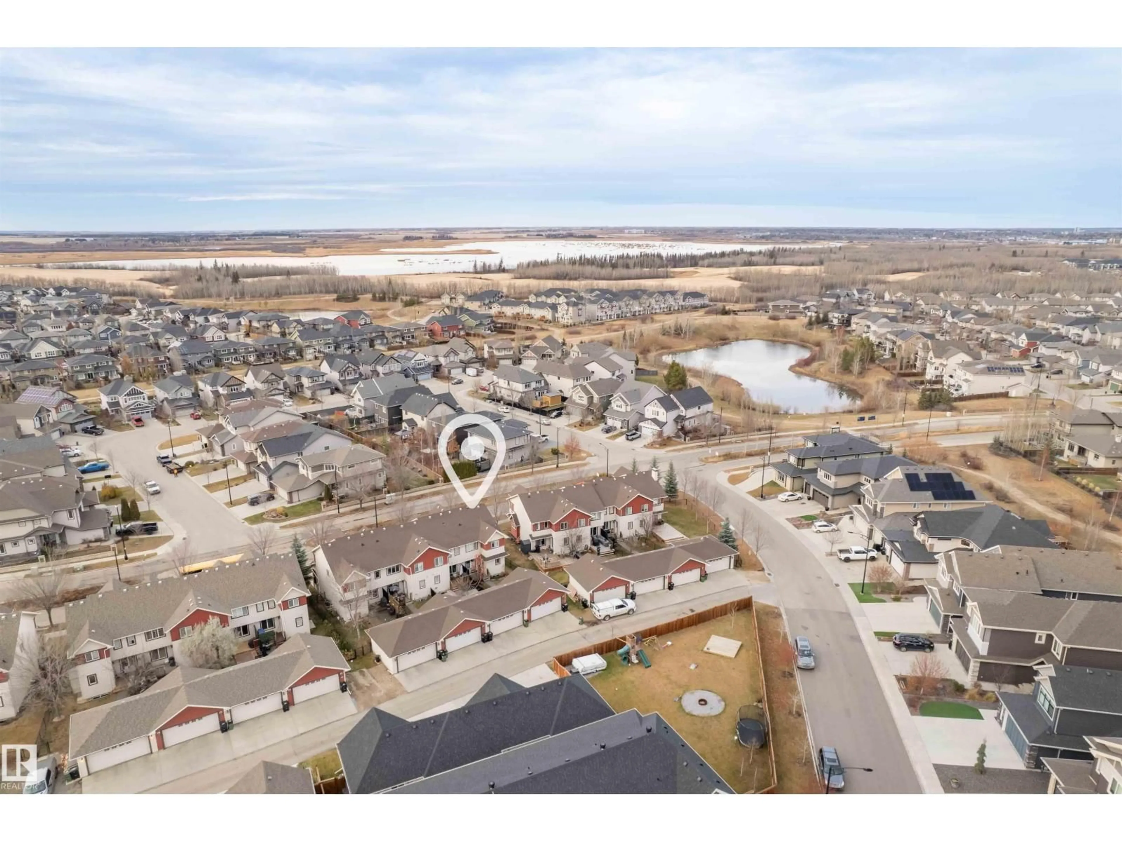 A pic from outside/outdoor area/front of a property/back of a property/a pic from drone, water/lake/river/ocean view for 2063 TRUMPETER WY, Edmonton Alberta T5S0E7