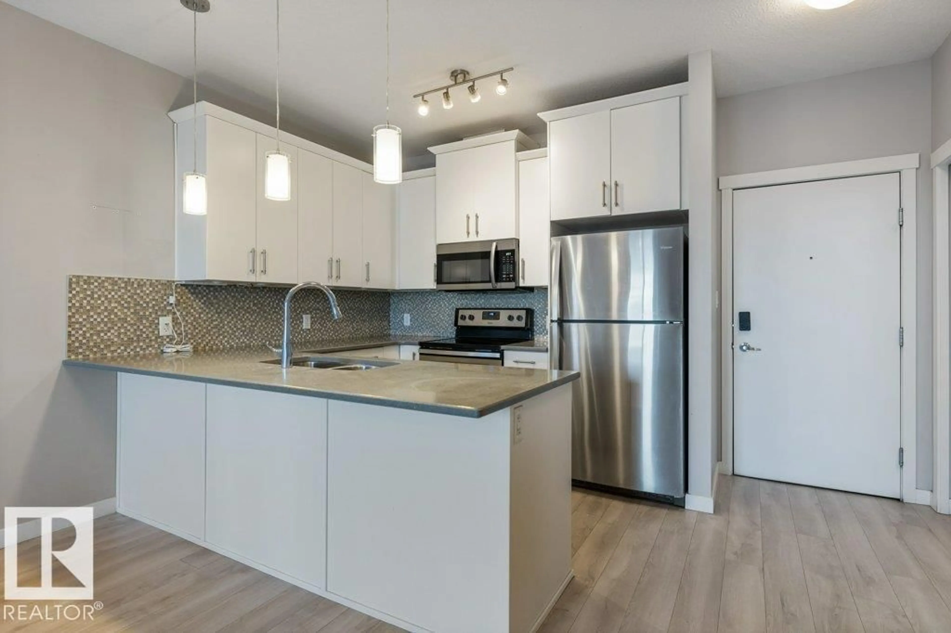 Open concept kitchen, wood/laminate floor for #304 - 812 WELSH DR, Edmonton Alberta T6X1Y7