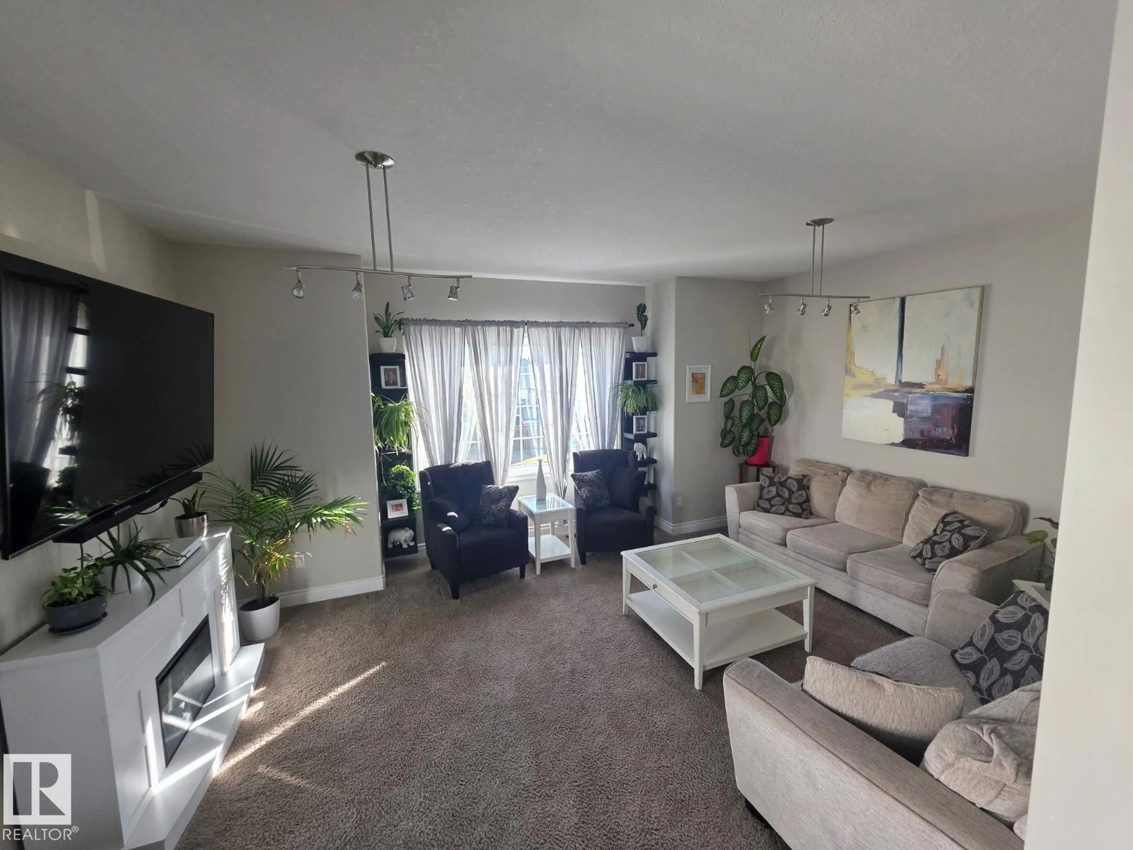 Living room with furniture, unknown for 10314 99 ST, Morinville Alberta T8R0C2