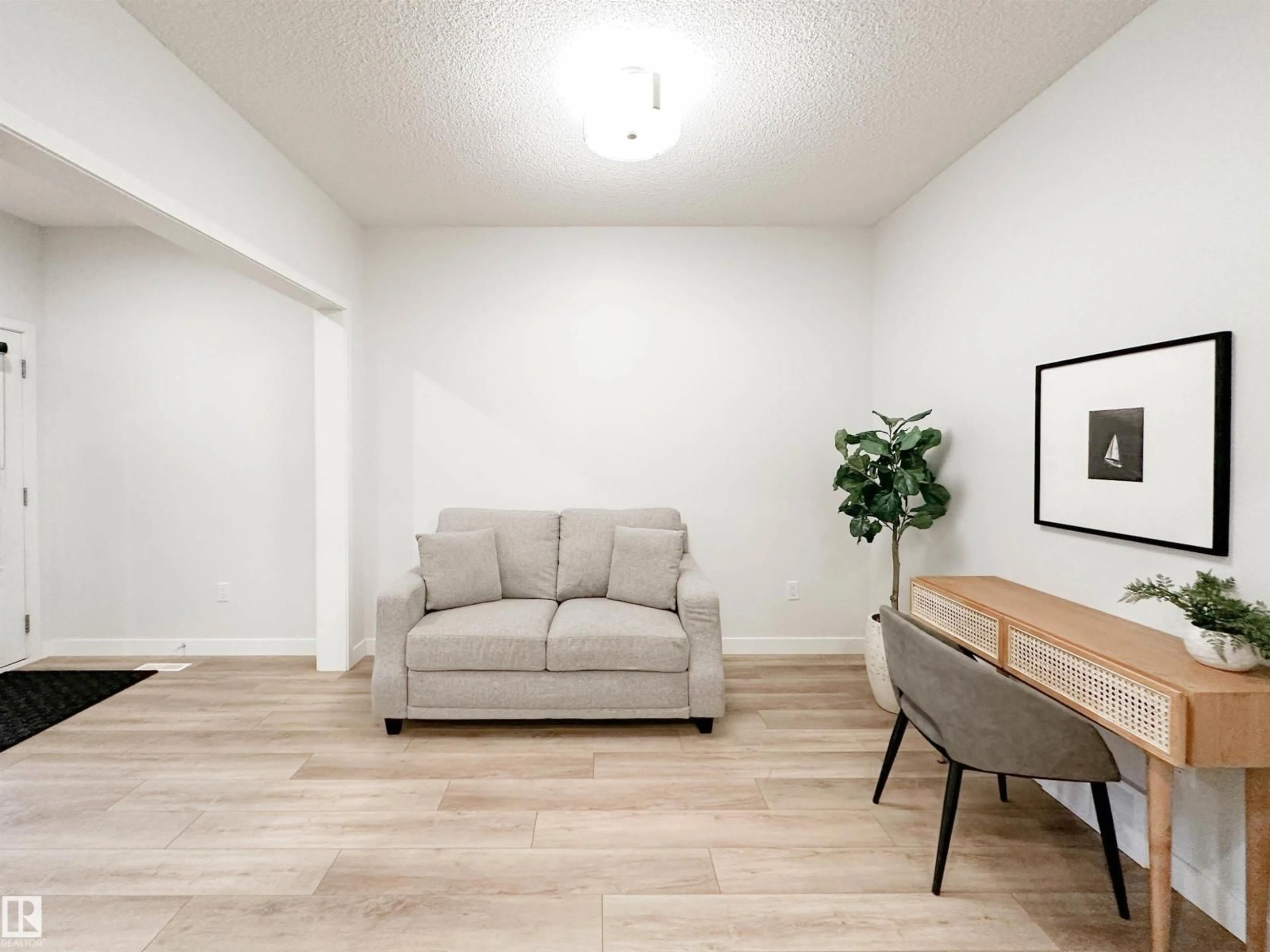 Living room with furniture, wood/laminate floor for 22614 99A AV, Edmonton Alberta T5T7V1