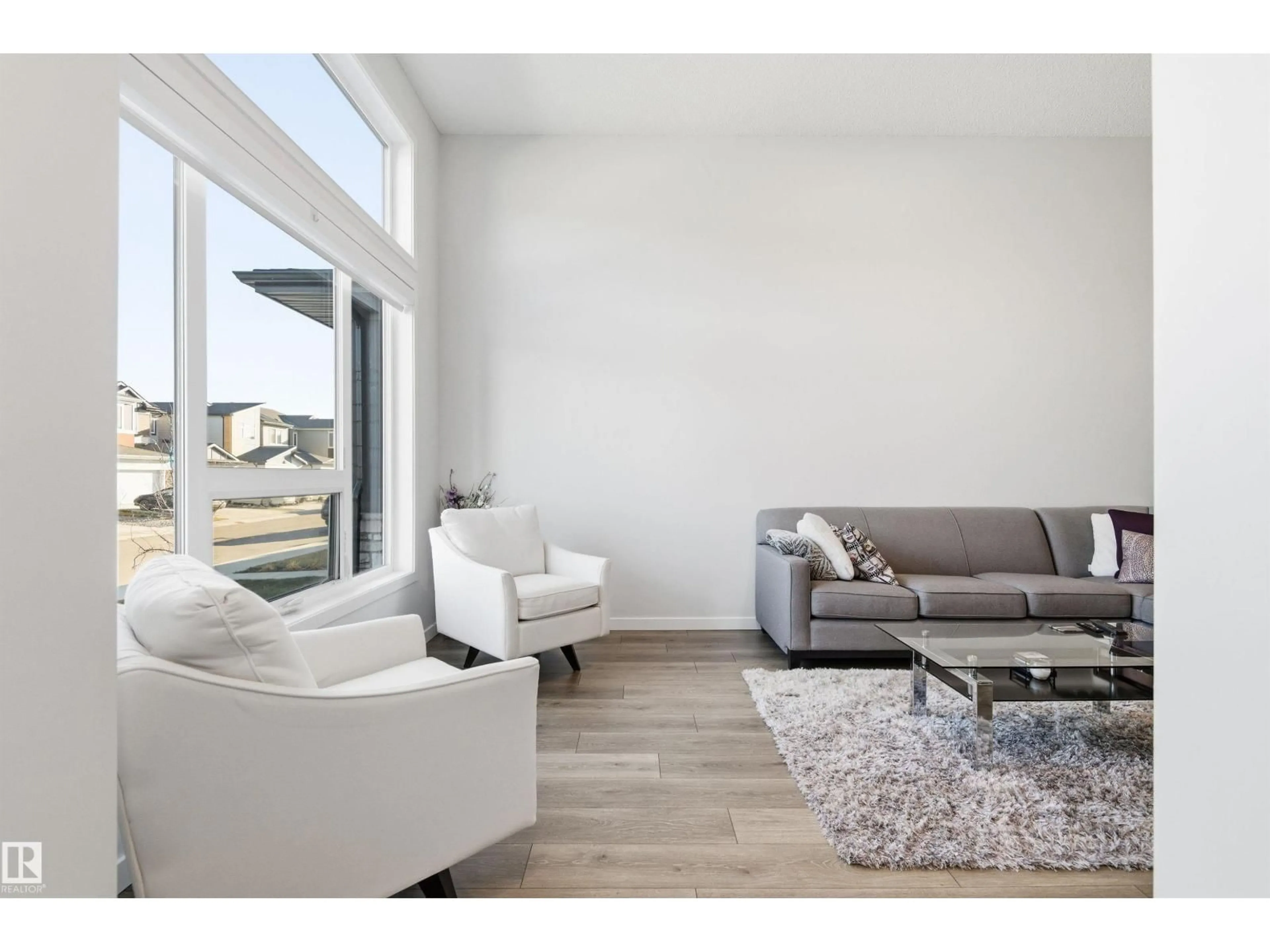 Living room with furniture, wood/laminate floor for SW - 656 35 ST, Edmonton Alberta T6X2Z1