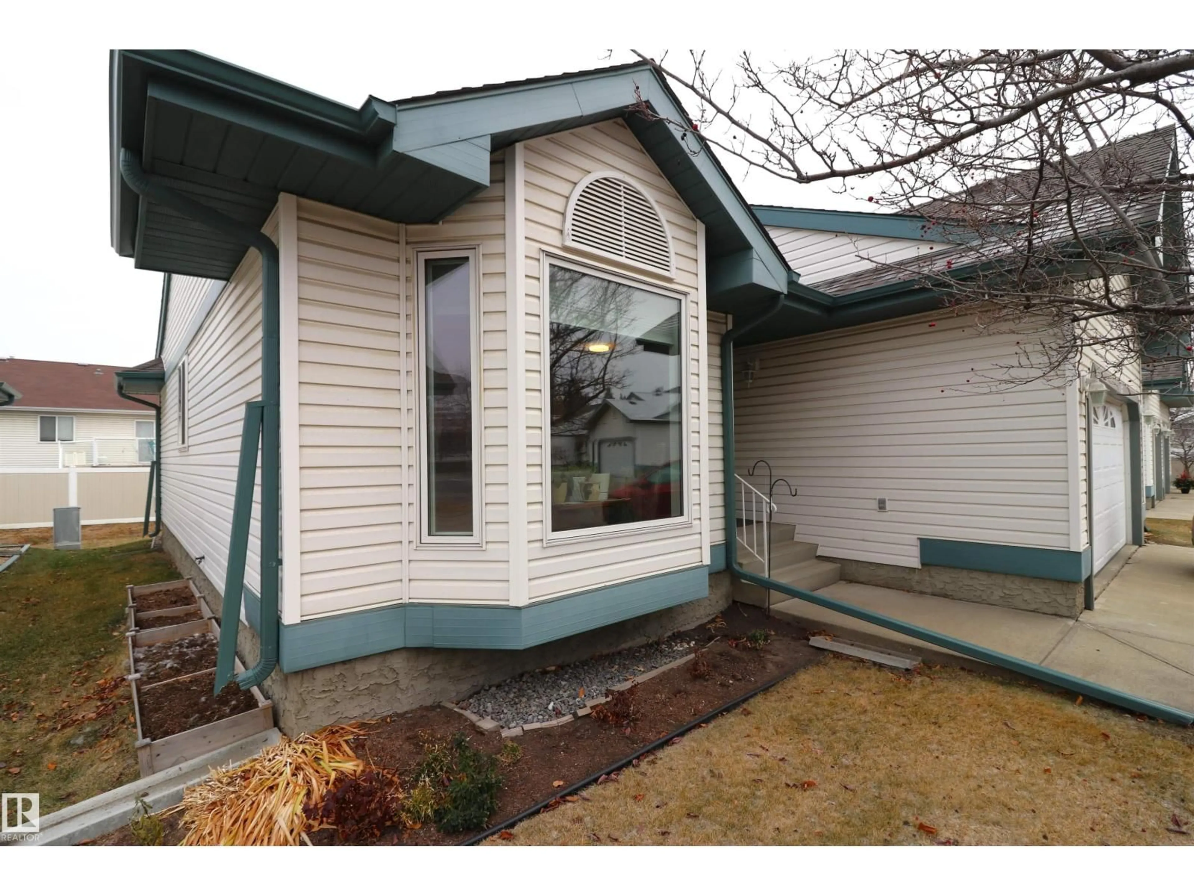 Home with vinyl exterior material, street for #13 - 308 JACKSON RD, Edmonton Alberta T6L6W1