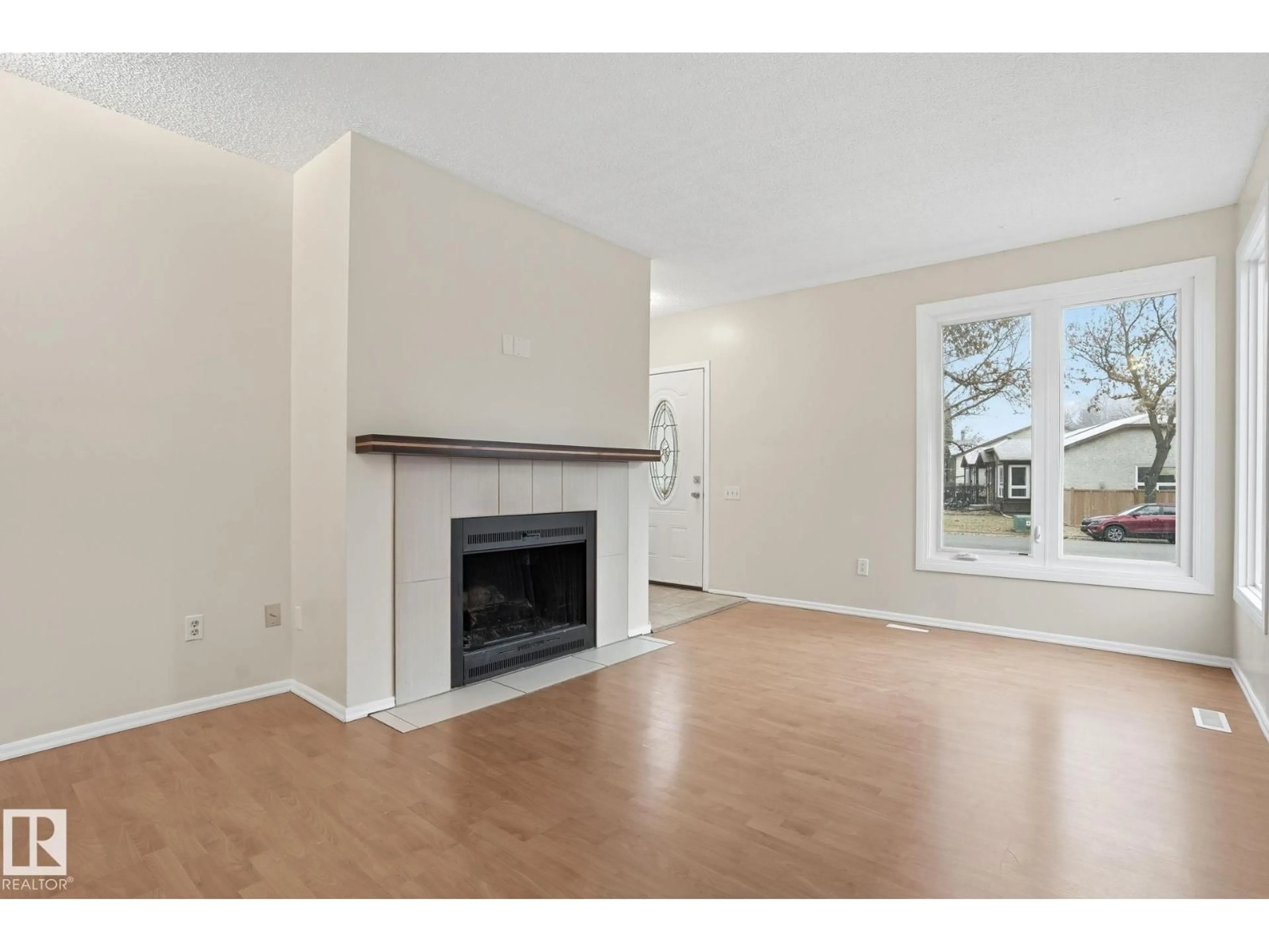 Living room with furniture, wood/laminate floor for 7 GARETH PL, St. Albert Alberta T8N3K5