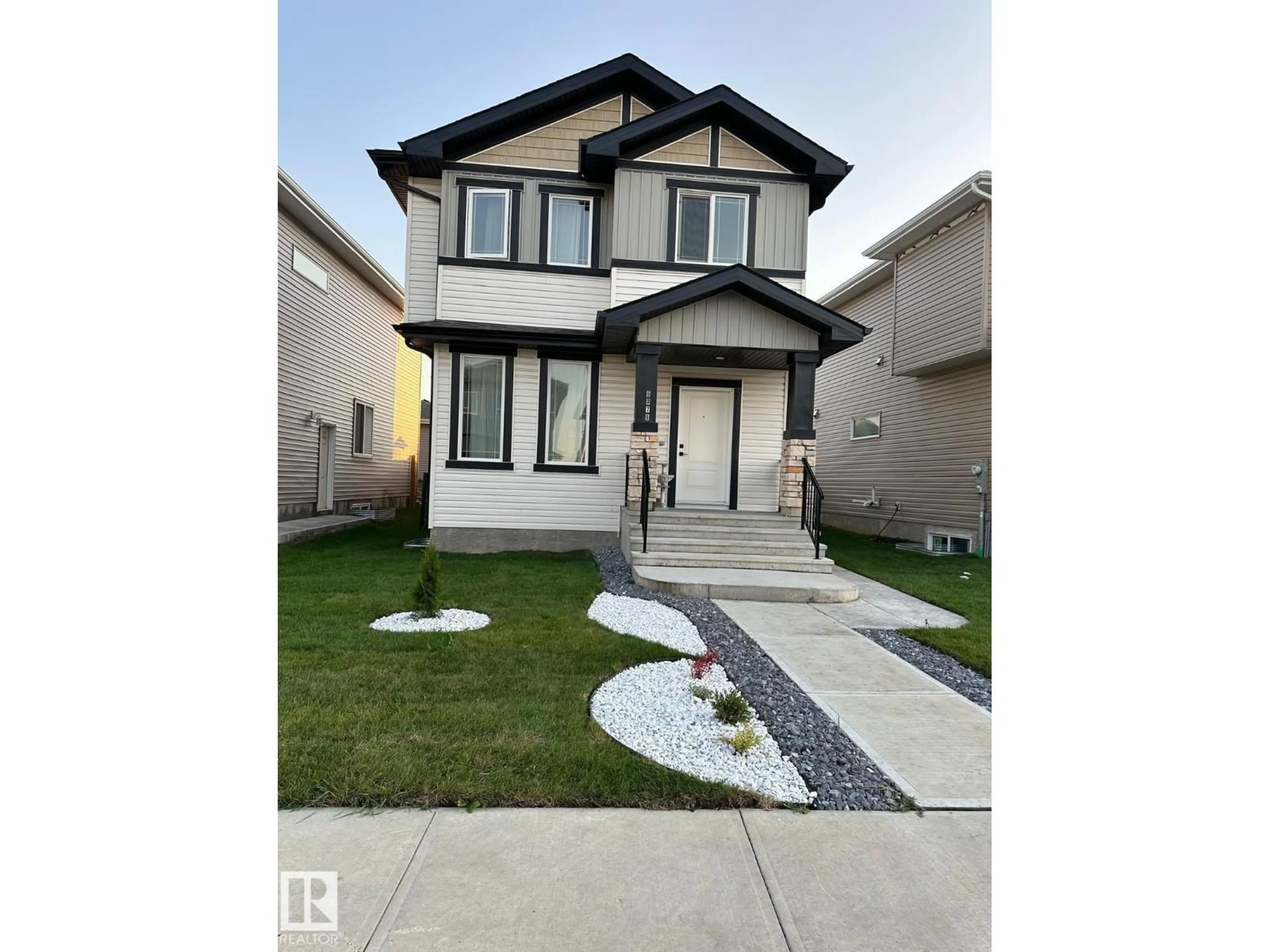Home with vinyl exterior material, street for 6079 180 AV, Edmonton Alberta T5Y3X1