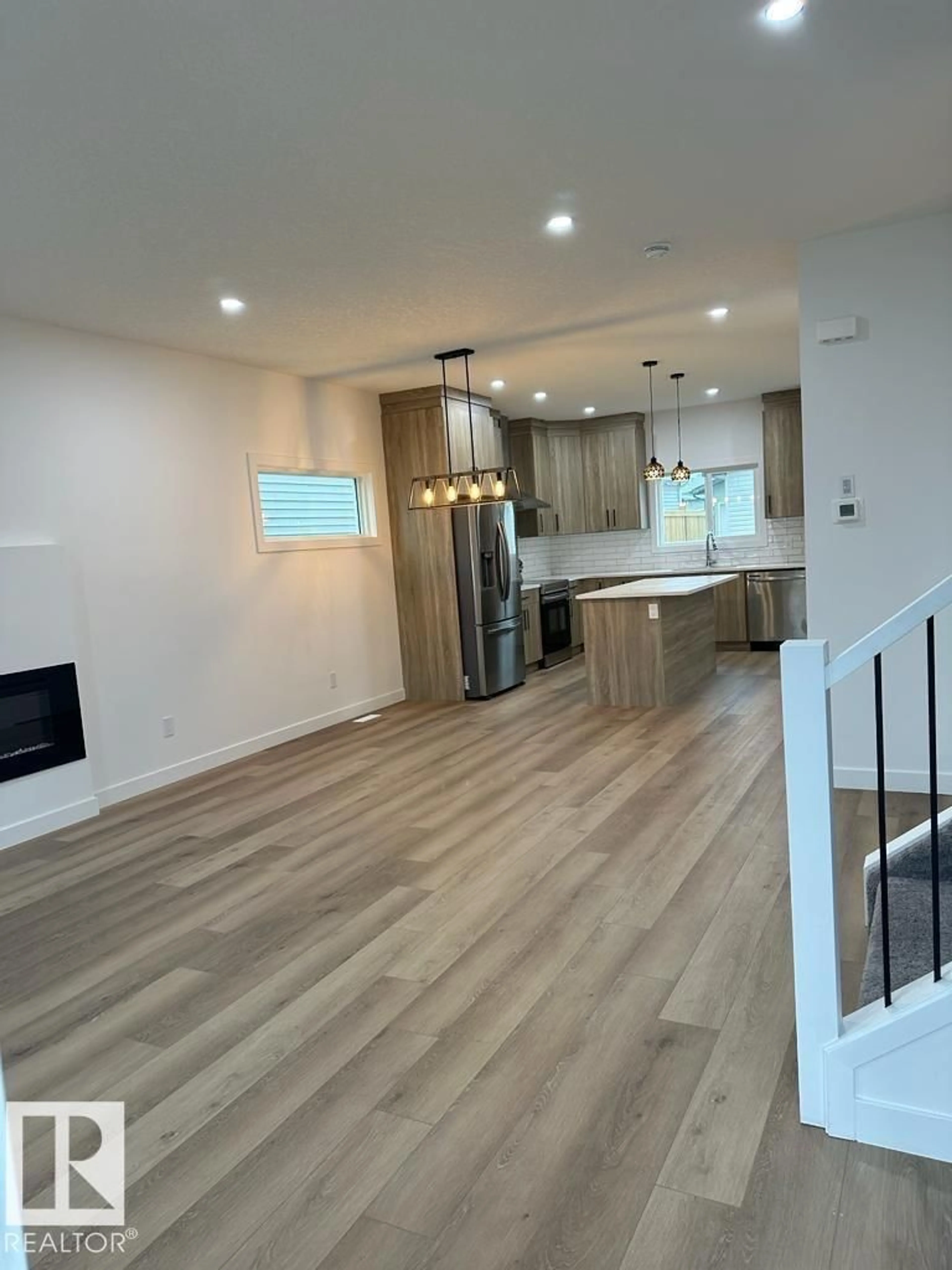 Open concept kitchen, wood/laminate floor for 6079 180 AV, Edmonton Alberta T5Y3X1