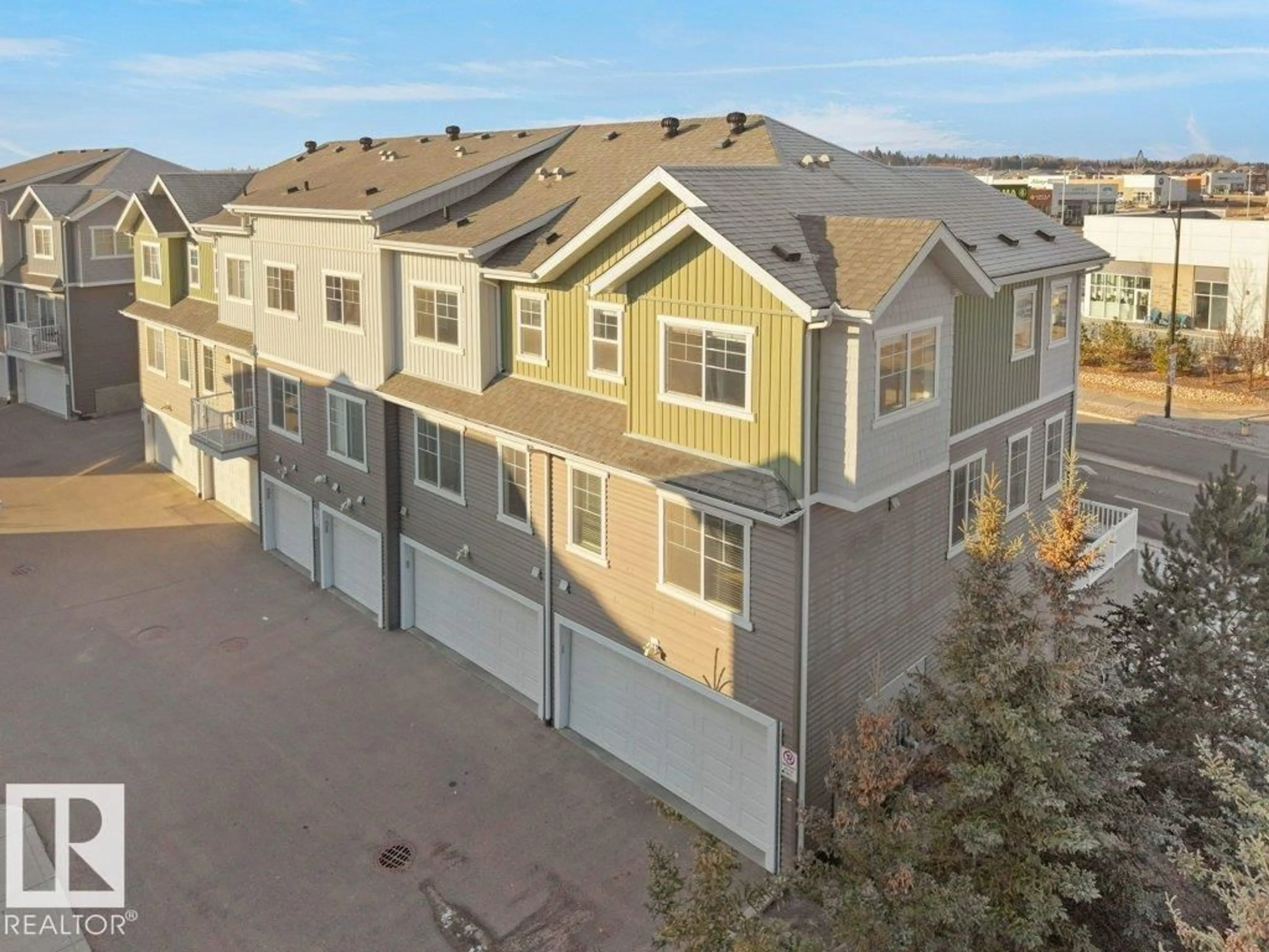 A pic from outside/outdoor area/front of a property/back of a property/a pic from drone, street for 15 - 7385 EDGEMONT WY, Edmonton Alberta T6M0R8
