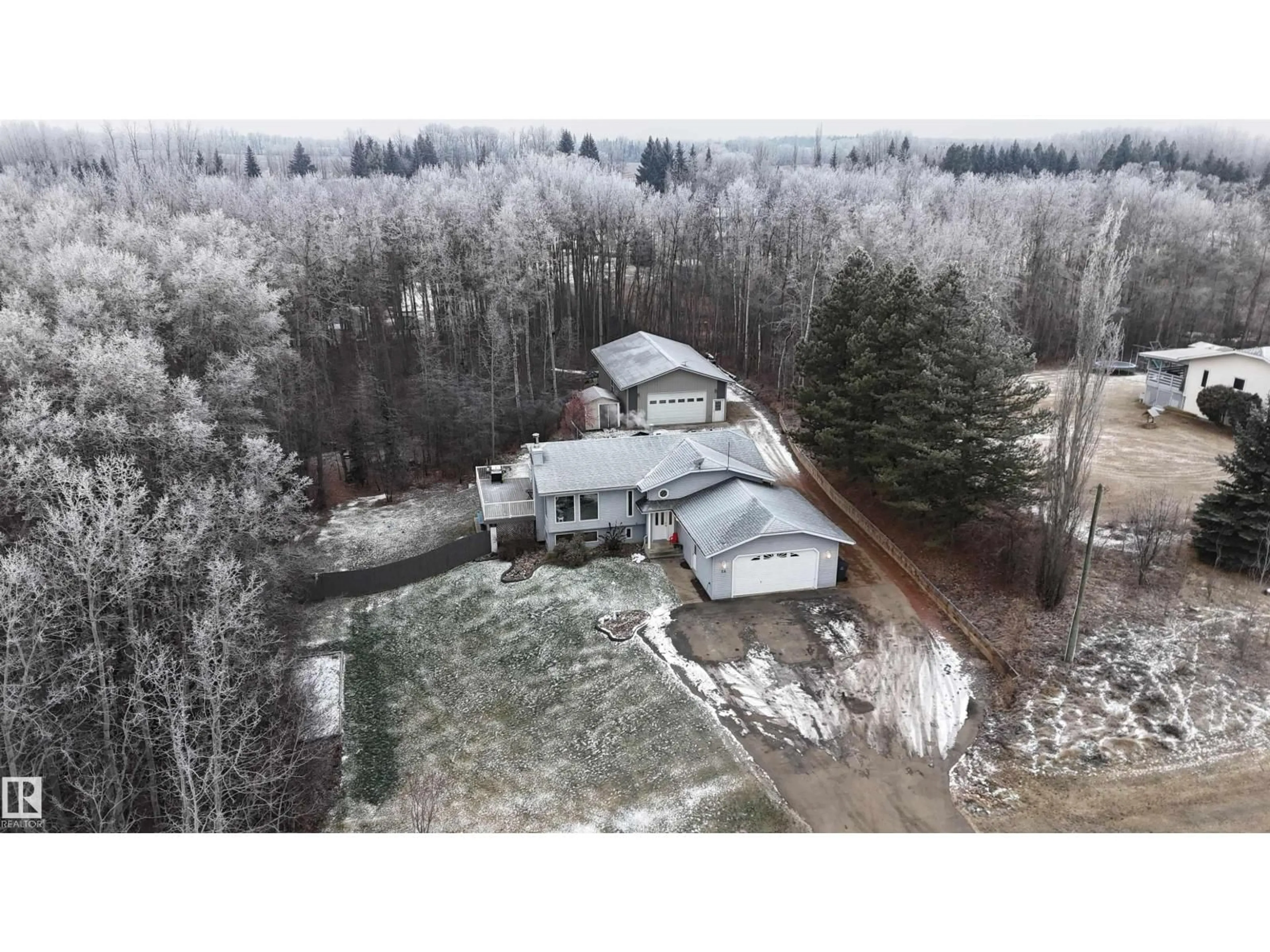 A pic from outside/outdoor area/front of a property/back of a property/a pic from drone, forest/trees view for 24 - 2228 PARKLAND DR, Rural Parkland County Alberta T0E0H0