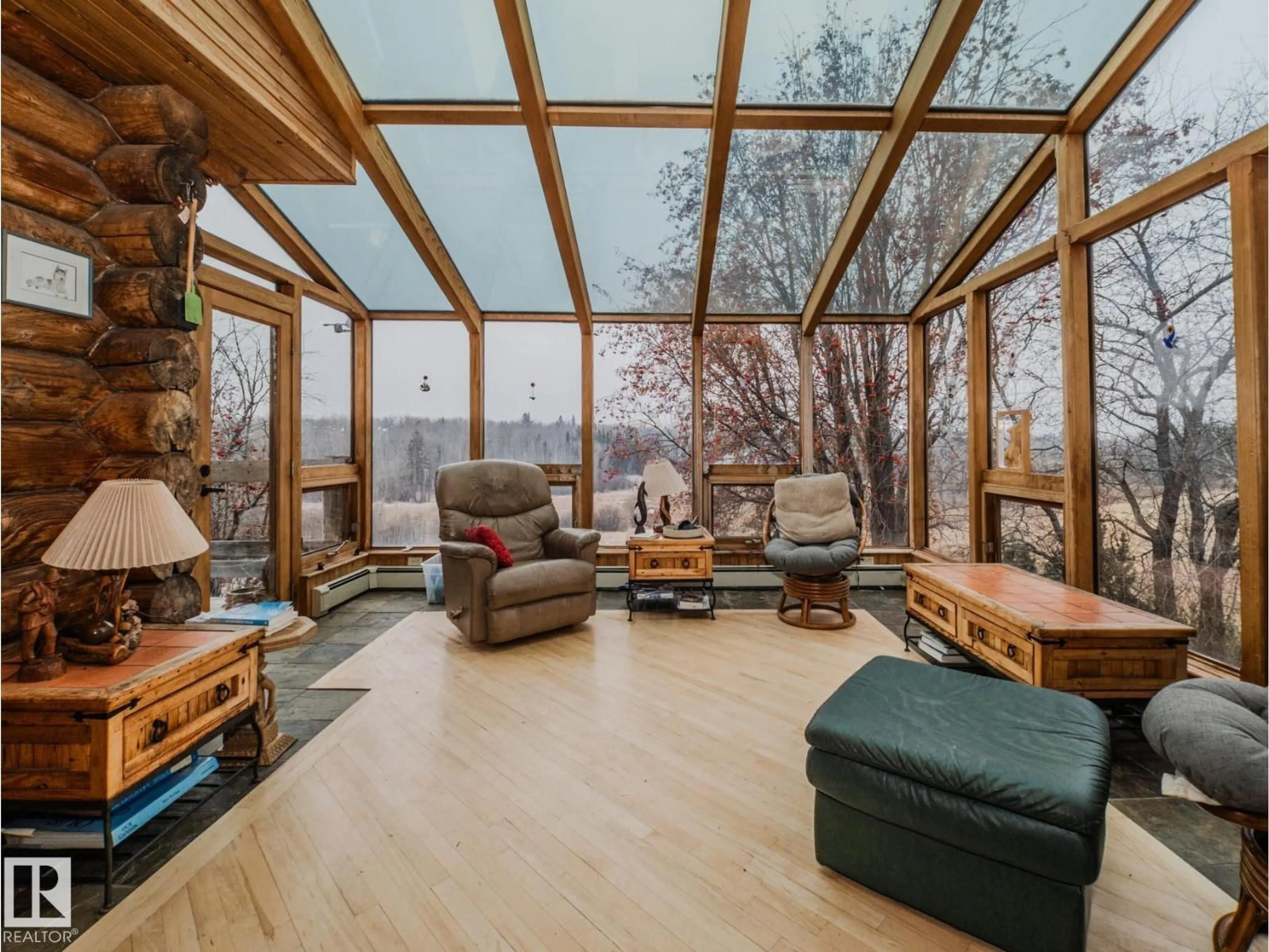 Living room with furniture, wood/laminate floor for 52028 RGE ROAD 224, Rural Strathcona County Alberta T8C1B7