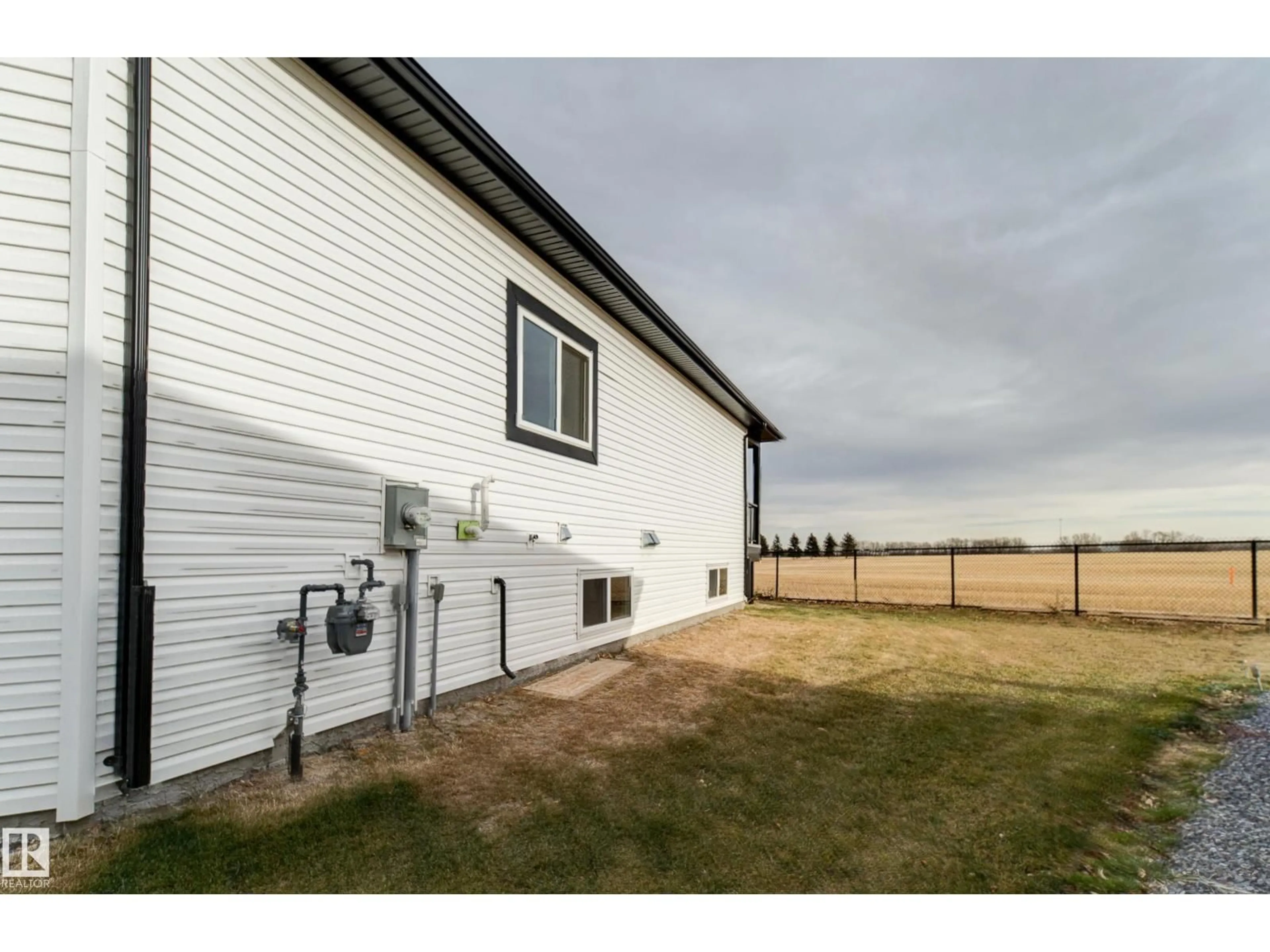 A pic from outside/outdoor area/front of a property/back of a property/a pic from drone, building for 15 - 6519 46 ST, Wetaskiwin Alberta T9A1Y5