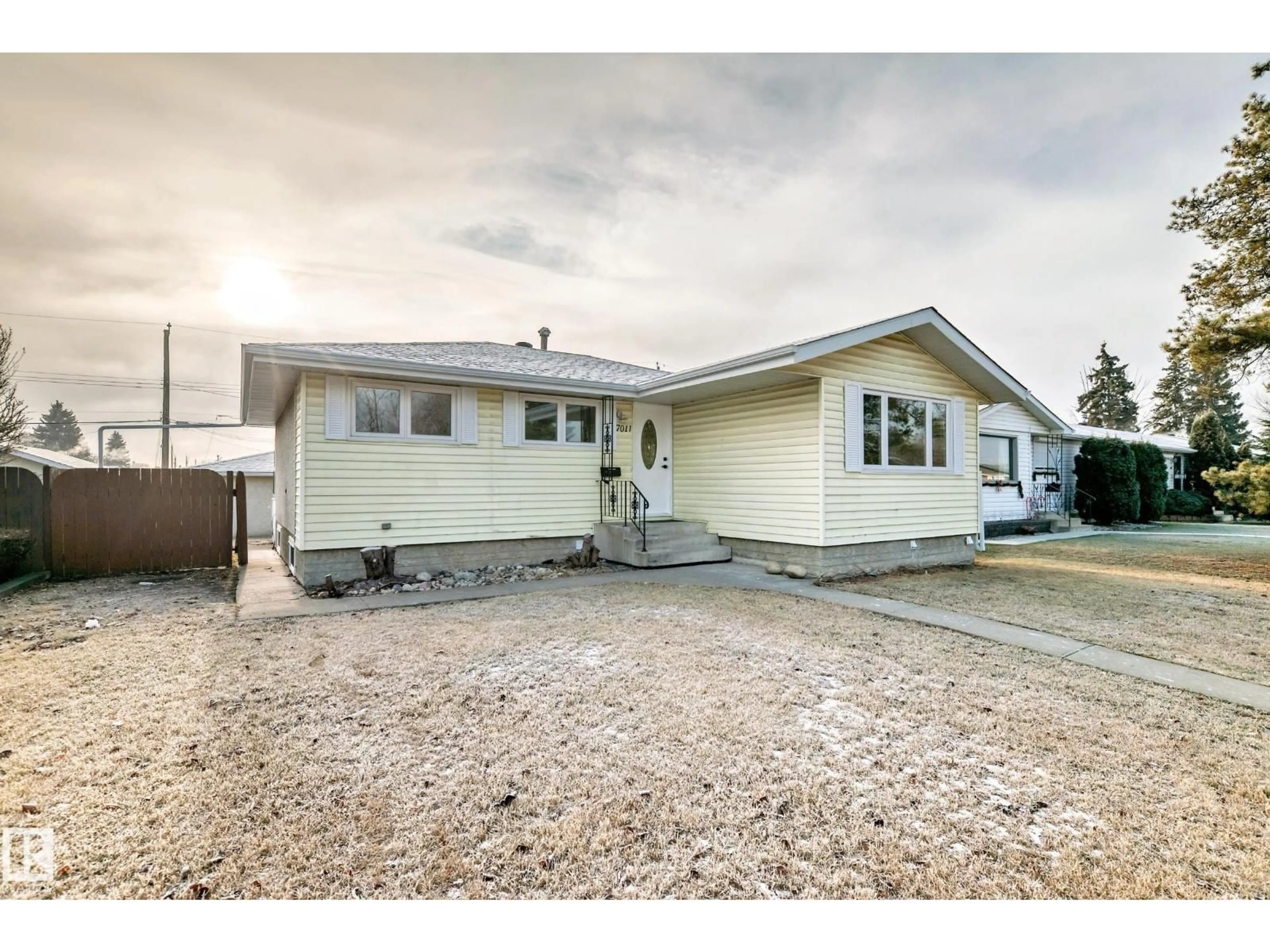 Home with vinyl exterior material, street for 7011 135A AV, Edmonton Alberta T5C2H7