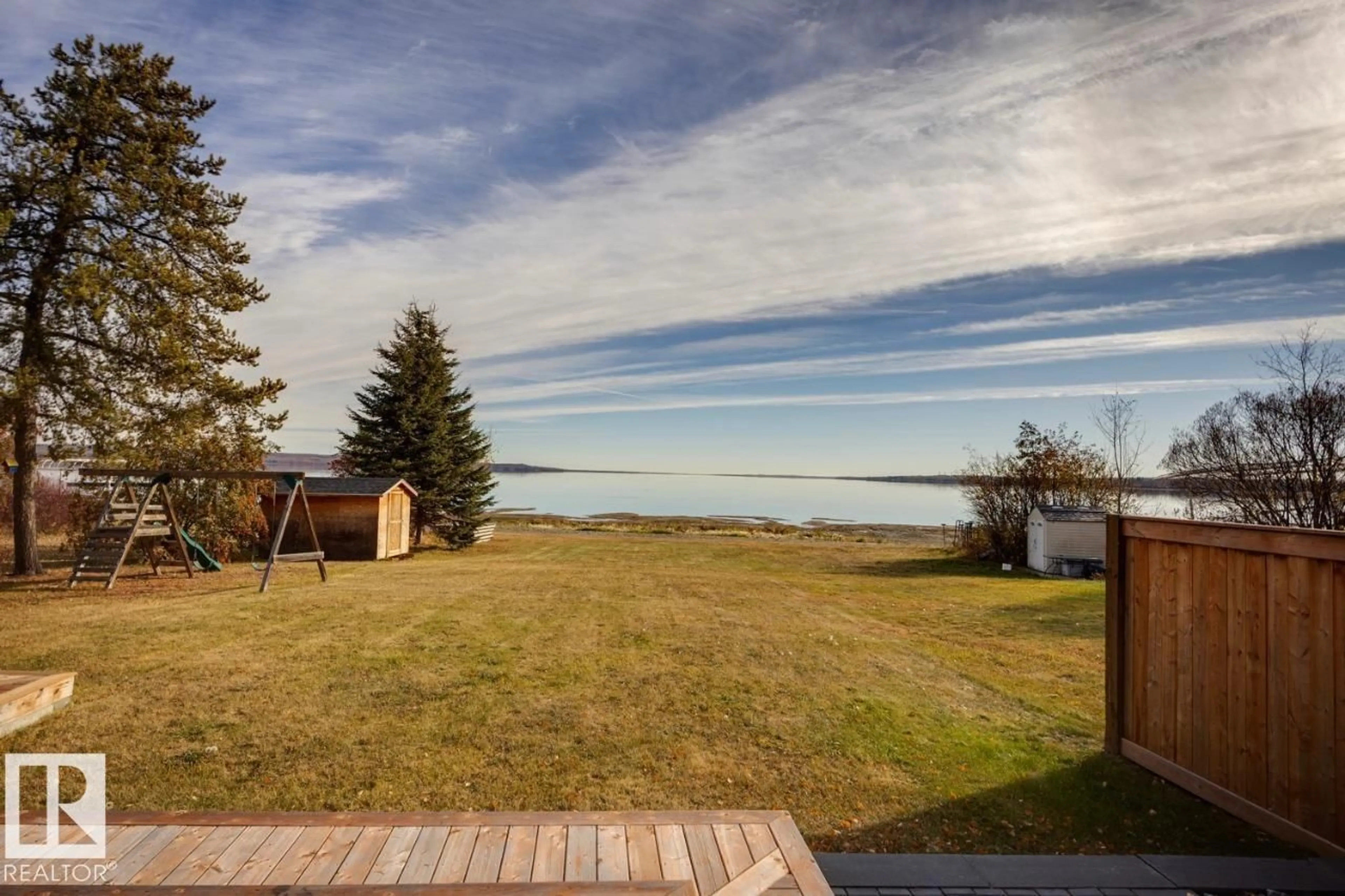 A pic from outside/outdoor area/front of a property/back of a property/a pic from drone, water/lake/river/ocean view for 129 1 AV, Rural Parkland County Alberta T0E2B0