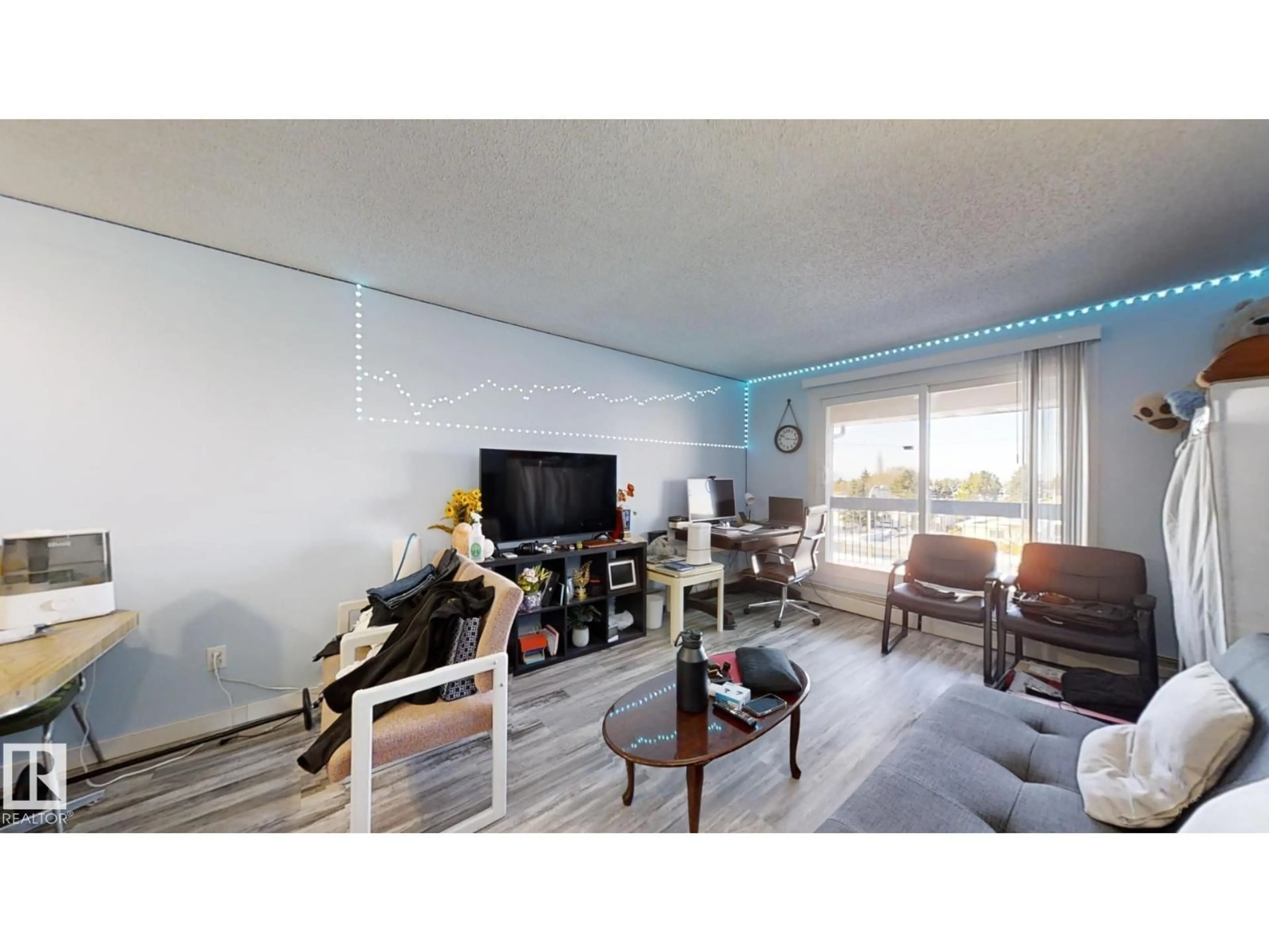 Living room with furniture, wood/laminate floor for #407 - 2624 MILL WOODS RD E, Edmonton Alberta T6L5K7