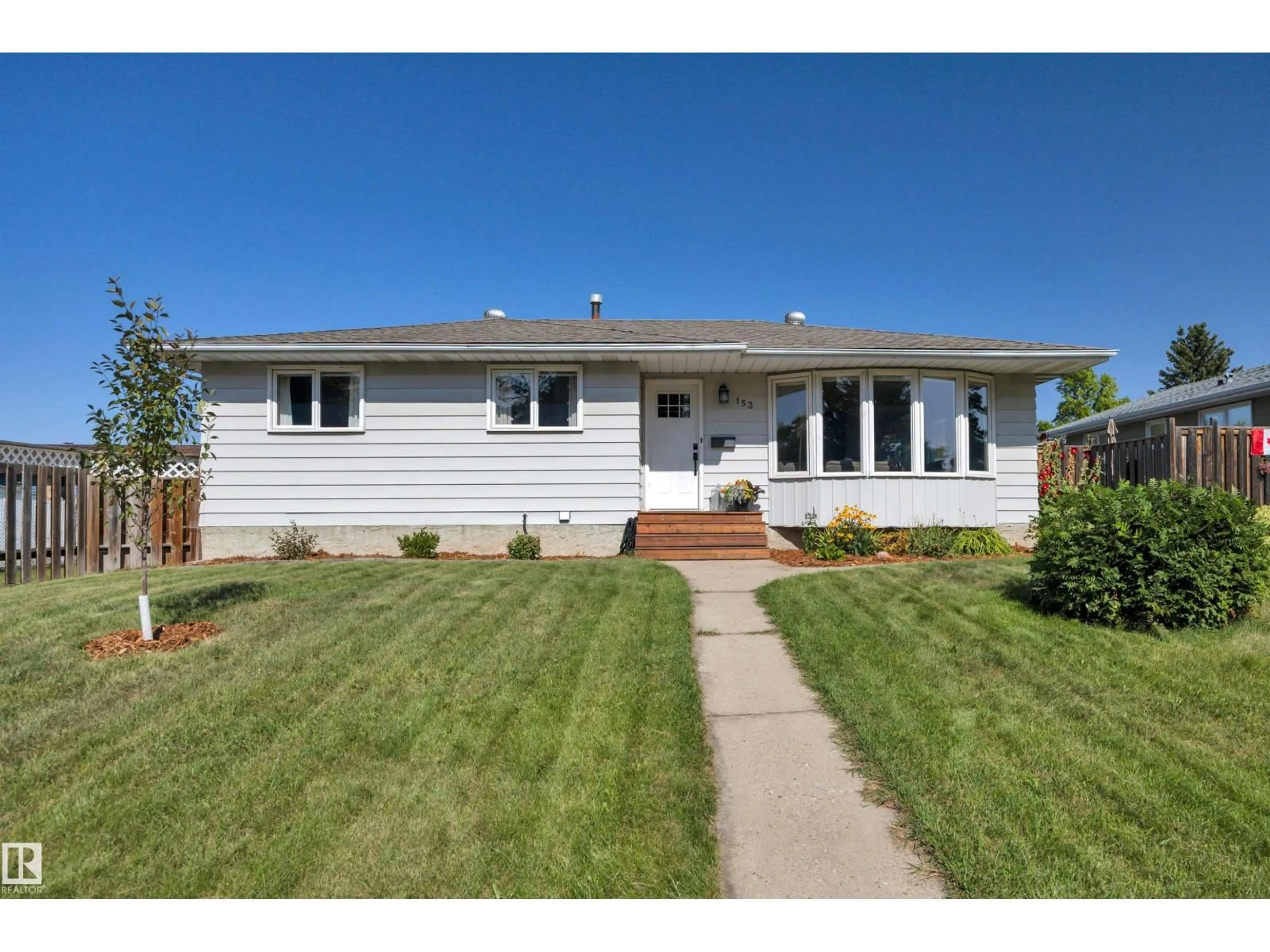 Home with vinyl exterior material, street for 153 CAMELOT AV, Leduc Alberta T9E4K7