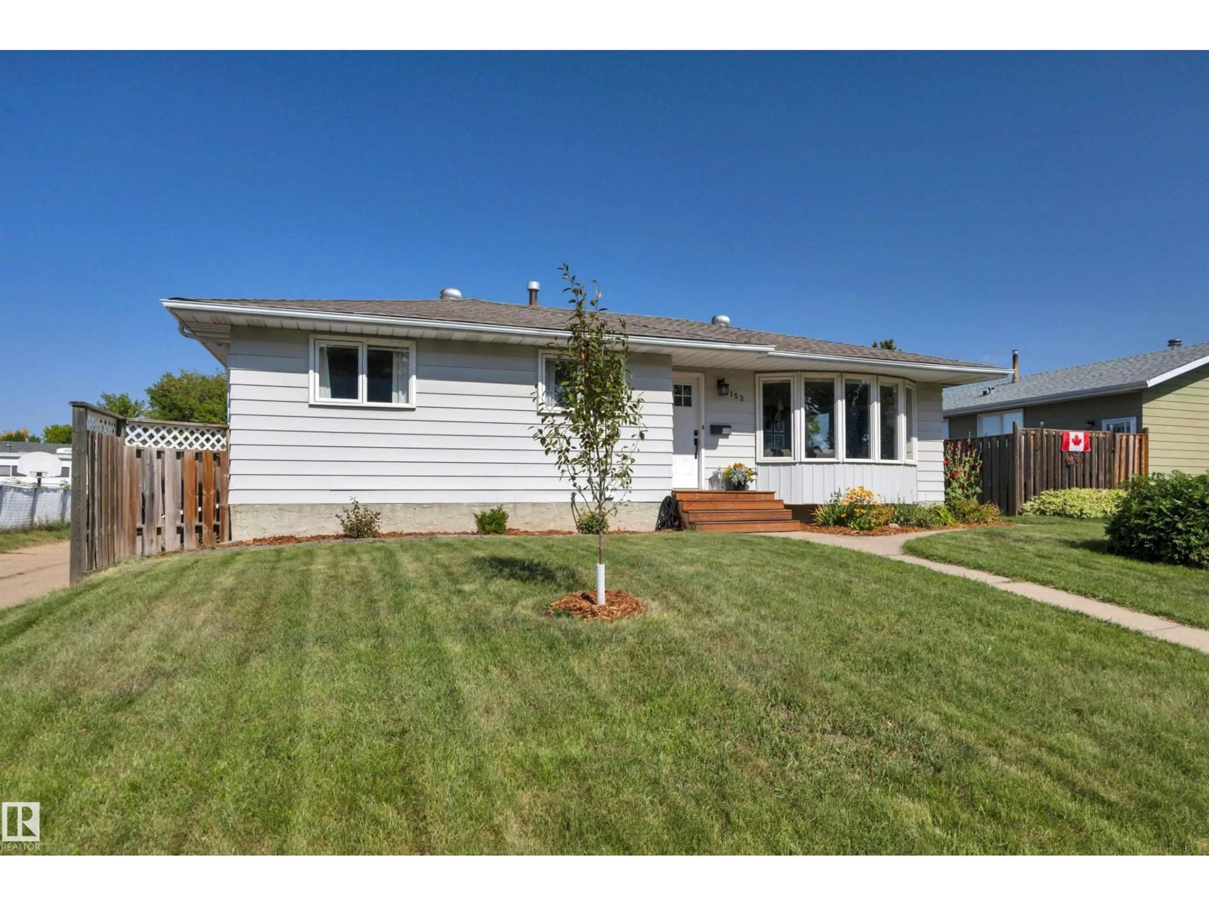 Home with vinyl exterior material, street for 153 CAMELOT AV, Leduc Alberta T9E4K7