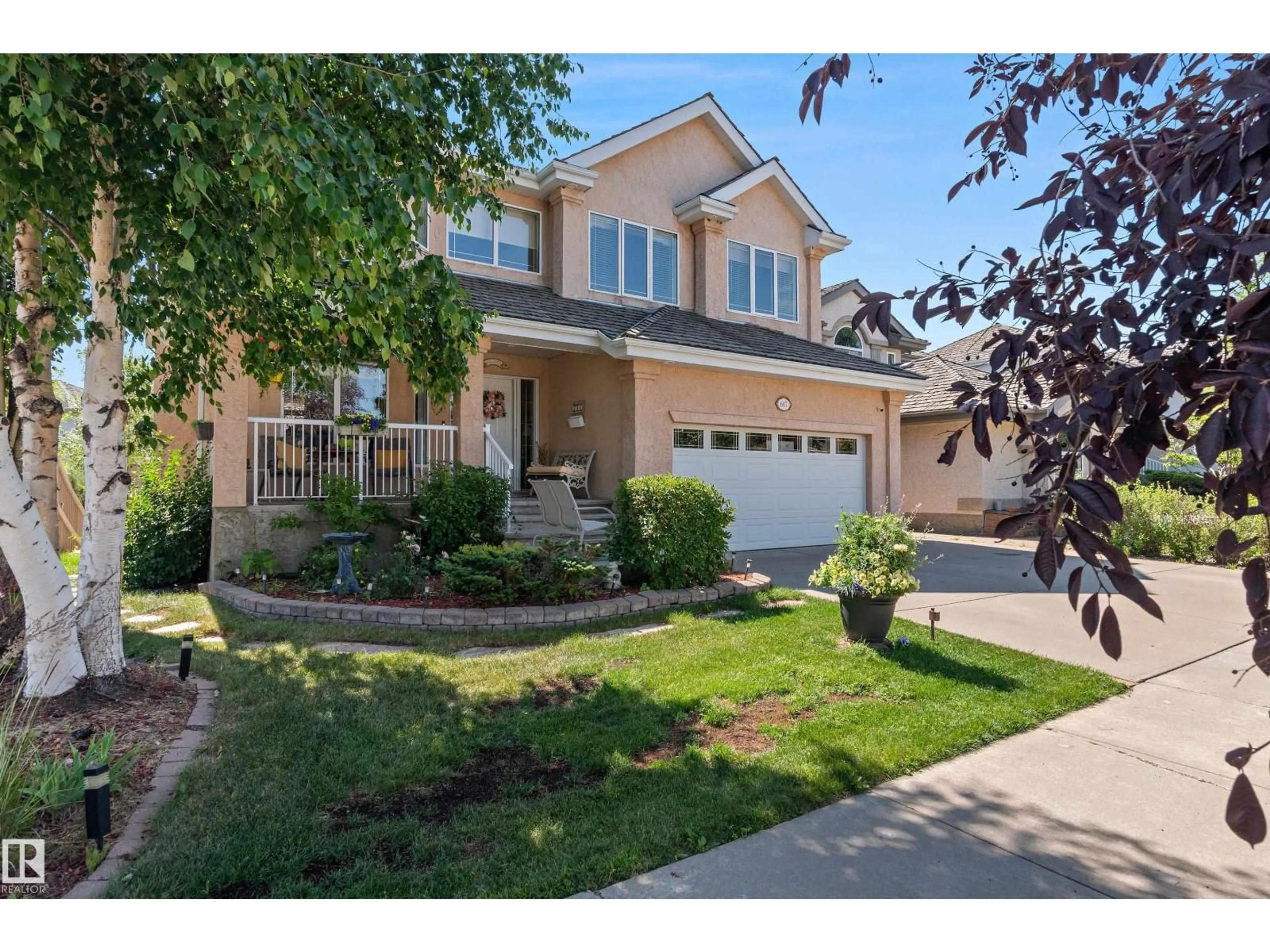 Home with vinyl exterior material, street for 617 DALHOUSIE CR, Edmonton Alberta T6M2T4