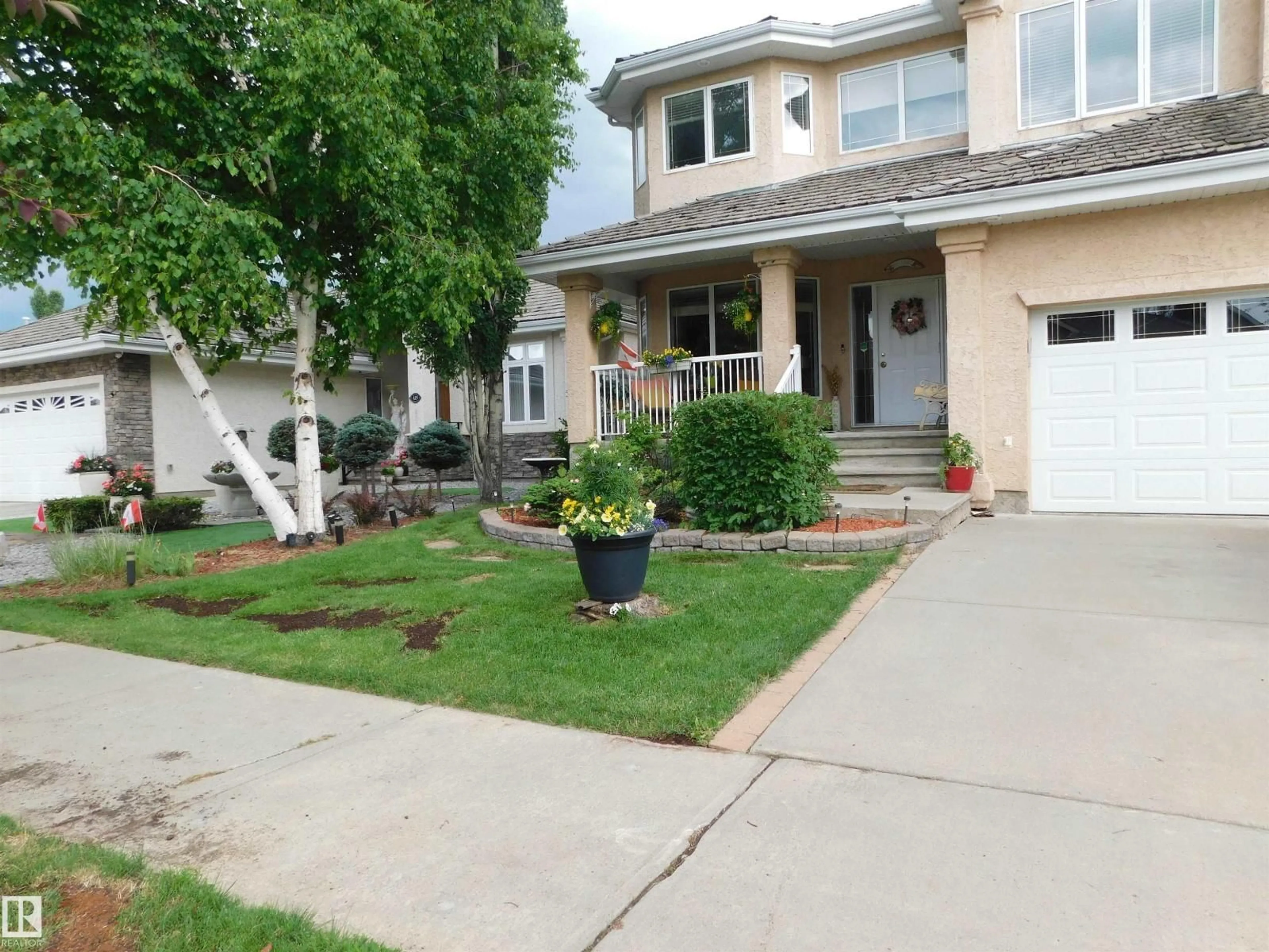 Home with vinyl exterior material, street for 617 DALHOUSIE CR, Edmonton Alberta T6M2T4